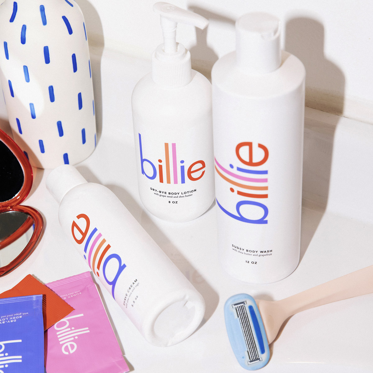 A collection of Billie products. including a razor and body care products