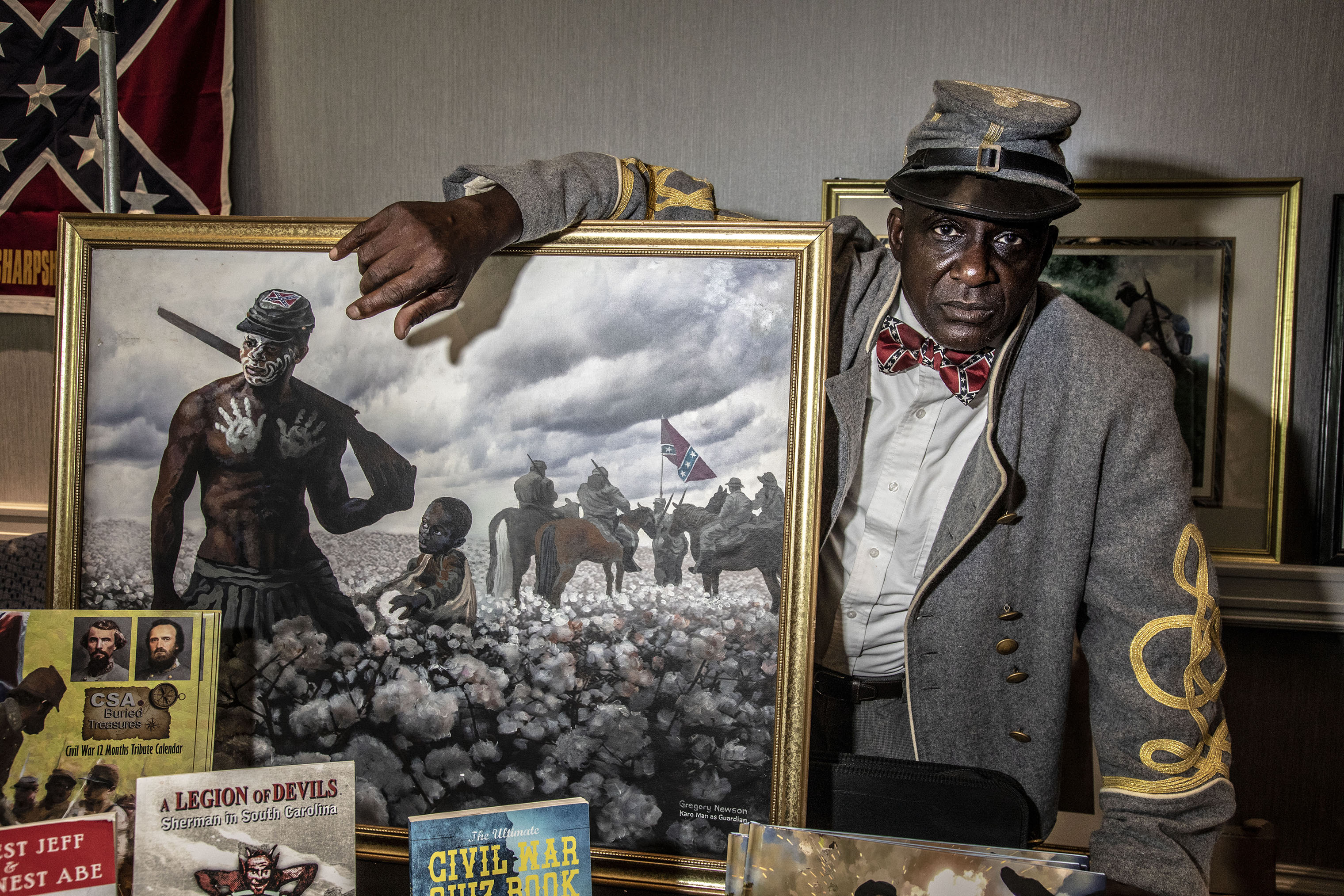 Artist and Confederate supporter Gregory Goodwin Newson at his booth in the vendors area of the Sons of Confederate Veterans national convention. Newson paints pictures of Black Confederate soldiers. (Mark Peterson—Redux for TIME)
