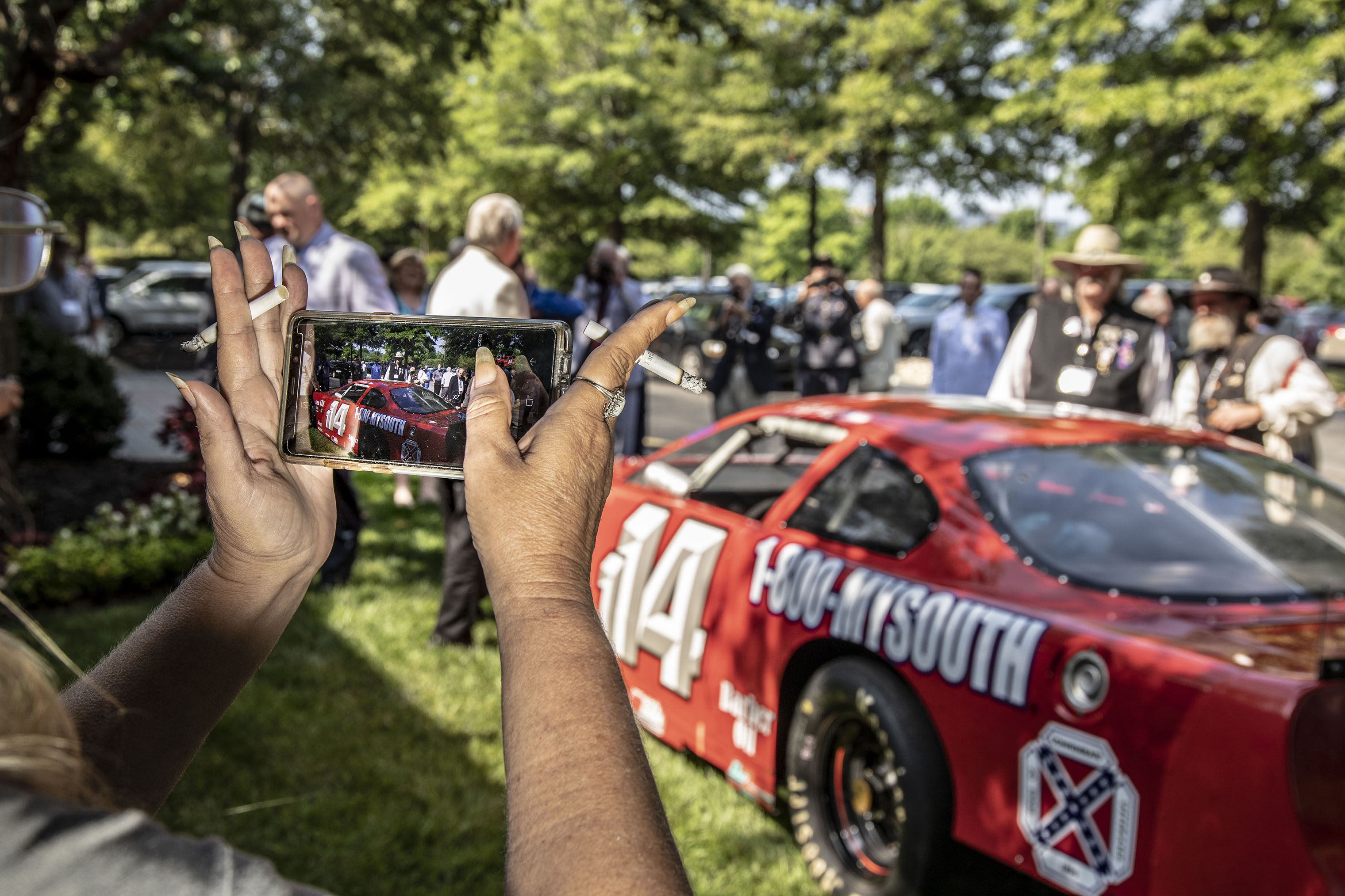 A race car sponsored by the Sons of Confederate Veterans sits outside the hotel hosting the national convention. (Mark Peterson—Redux for TIME)