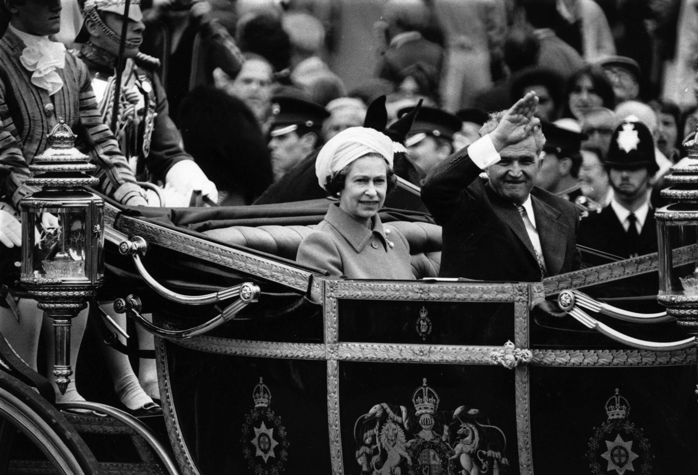 Romanian dictator Nicolae Ceausescu rides in the state carriage with Queen Elizabeth II on his official visit to Britain on June 13, 1978. (Central Press—Getty Images)