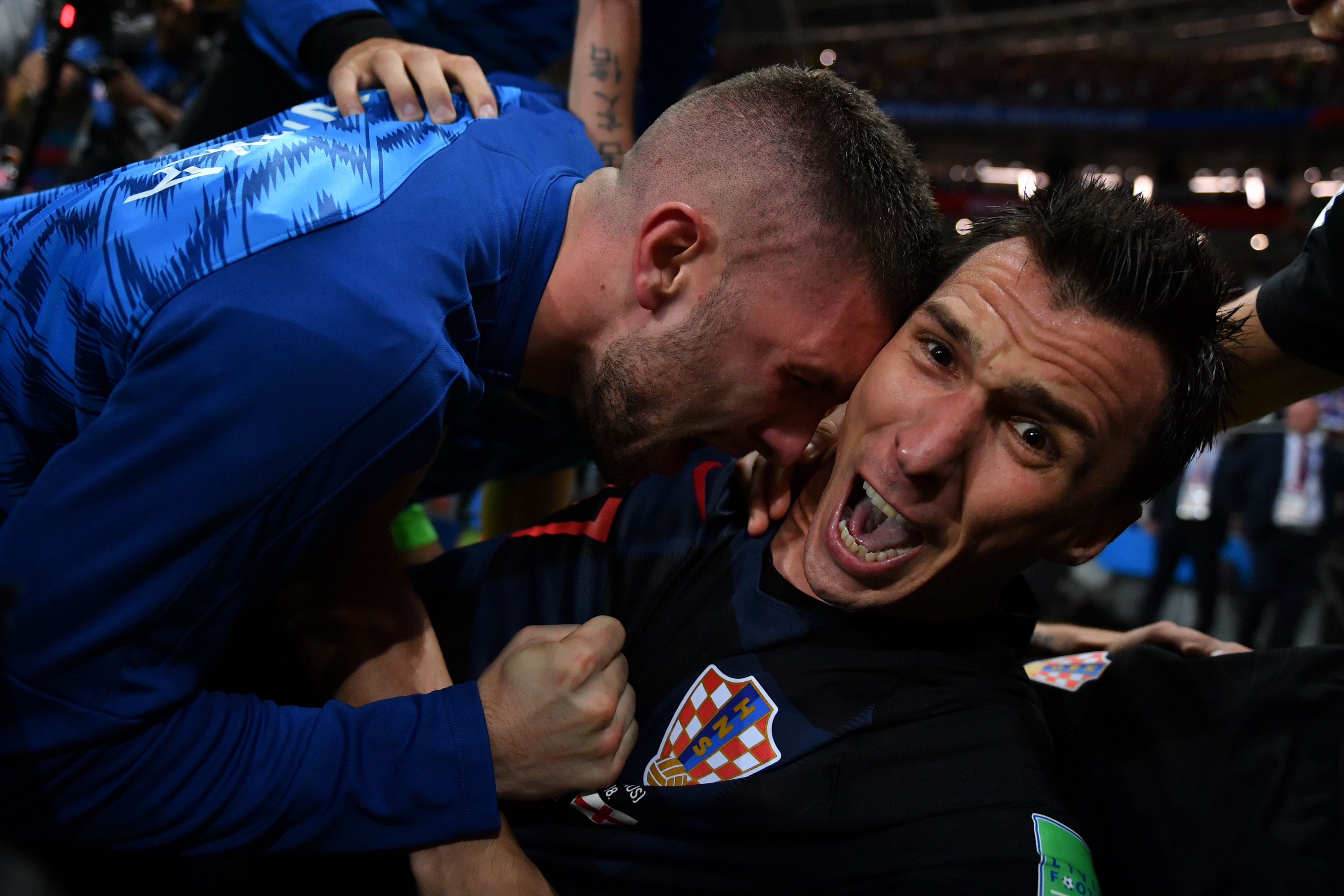 Croatia's forward Mario Mandzukic (R) celebrates with teammates after scoring his team's second goal during the semi-final game on July 11, 2018. (Yuri Cortez&mdash;AFP/Getty Images)