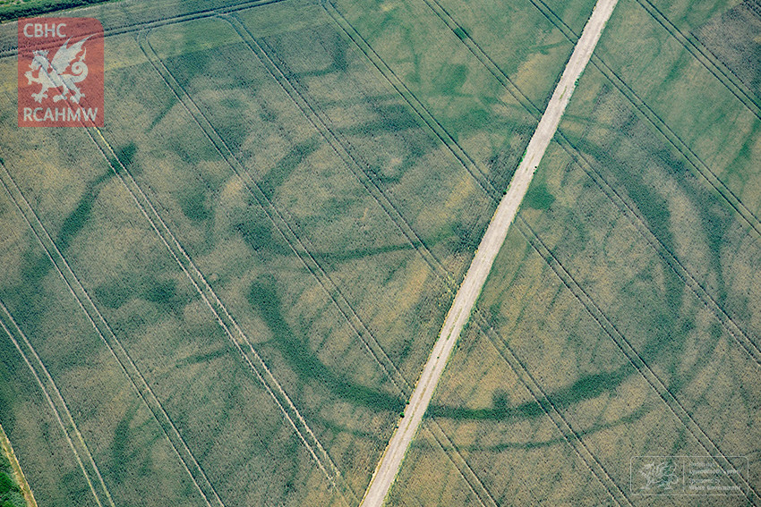 A large prehistoric circular structure in Wales revealed by hot weather. Surveyors think the hot weather has revealed traces of a Roman villa within. (RCAHMW)