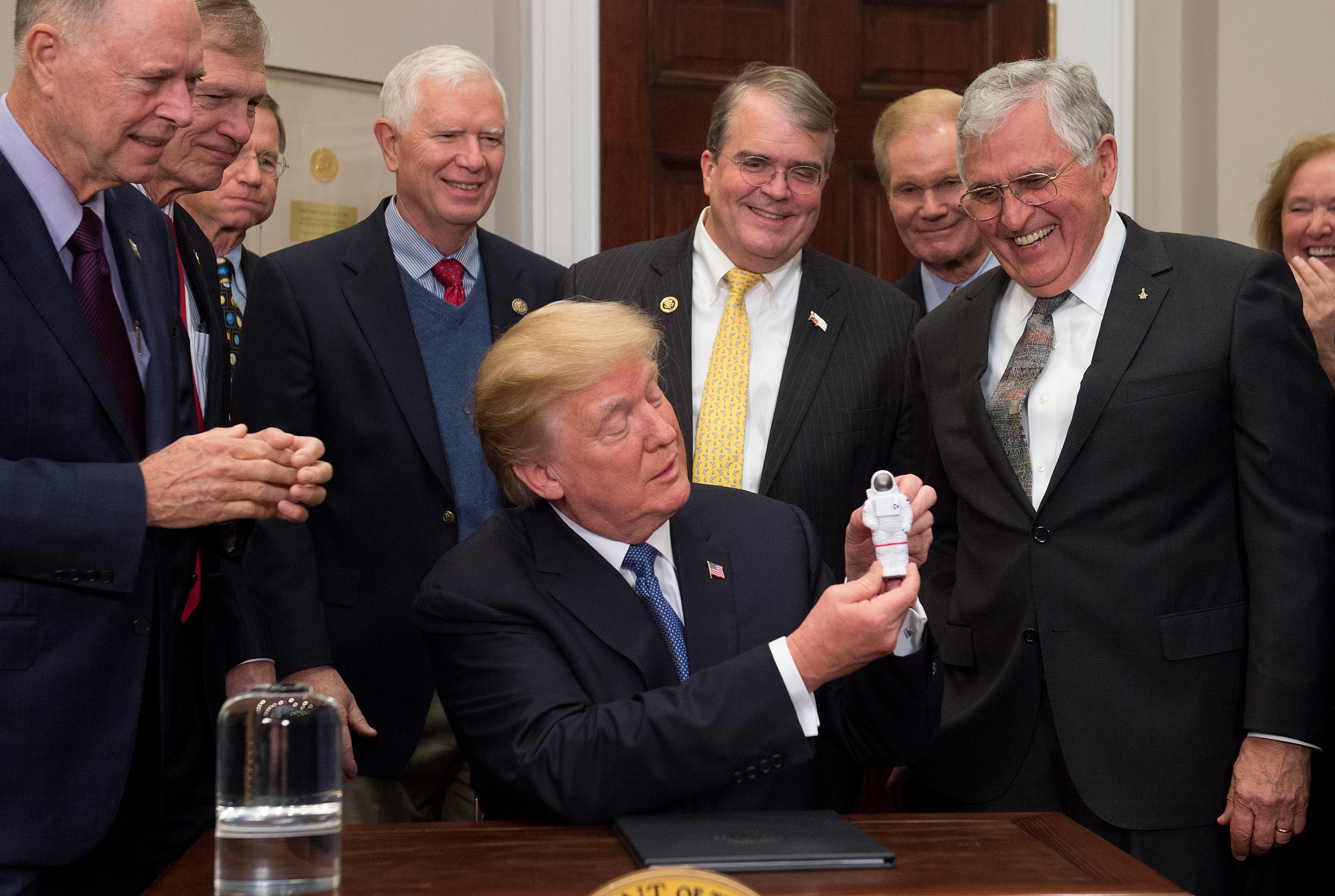 President Trump during the signing of his first space directive, with moonwalker and former Senator Harrison Schmitt, at right (Saul Loeb—AFP/Getty Images)