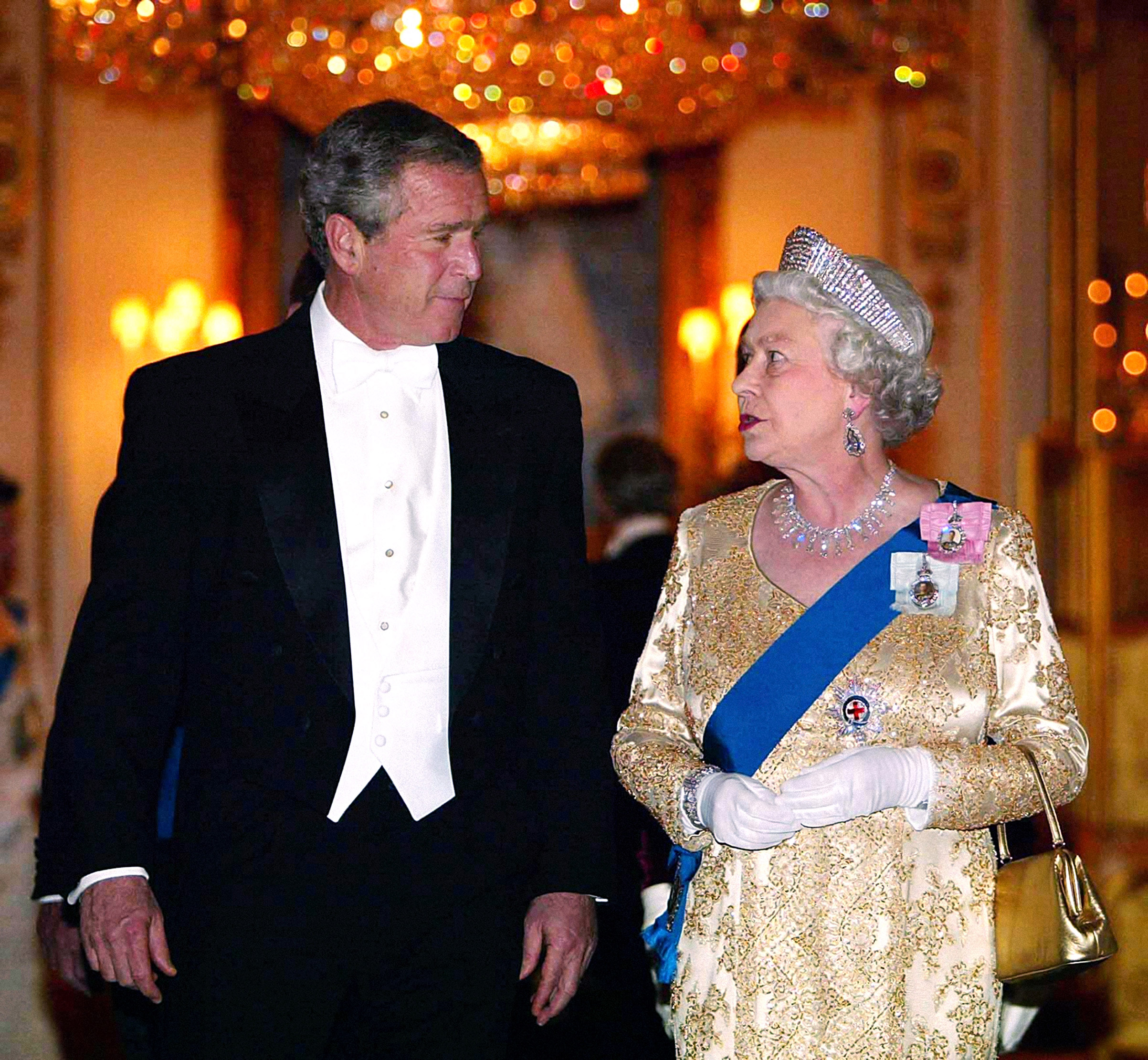 Britain's Queen Elizabeth II arrives with U.S. President George Bush for the Buckingham Palace state banquet in honor of the U.S. President, during the first day of his four-day state visit to the U.K. on Nov. 19, 2003. (PA Images—Getty Images)