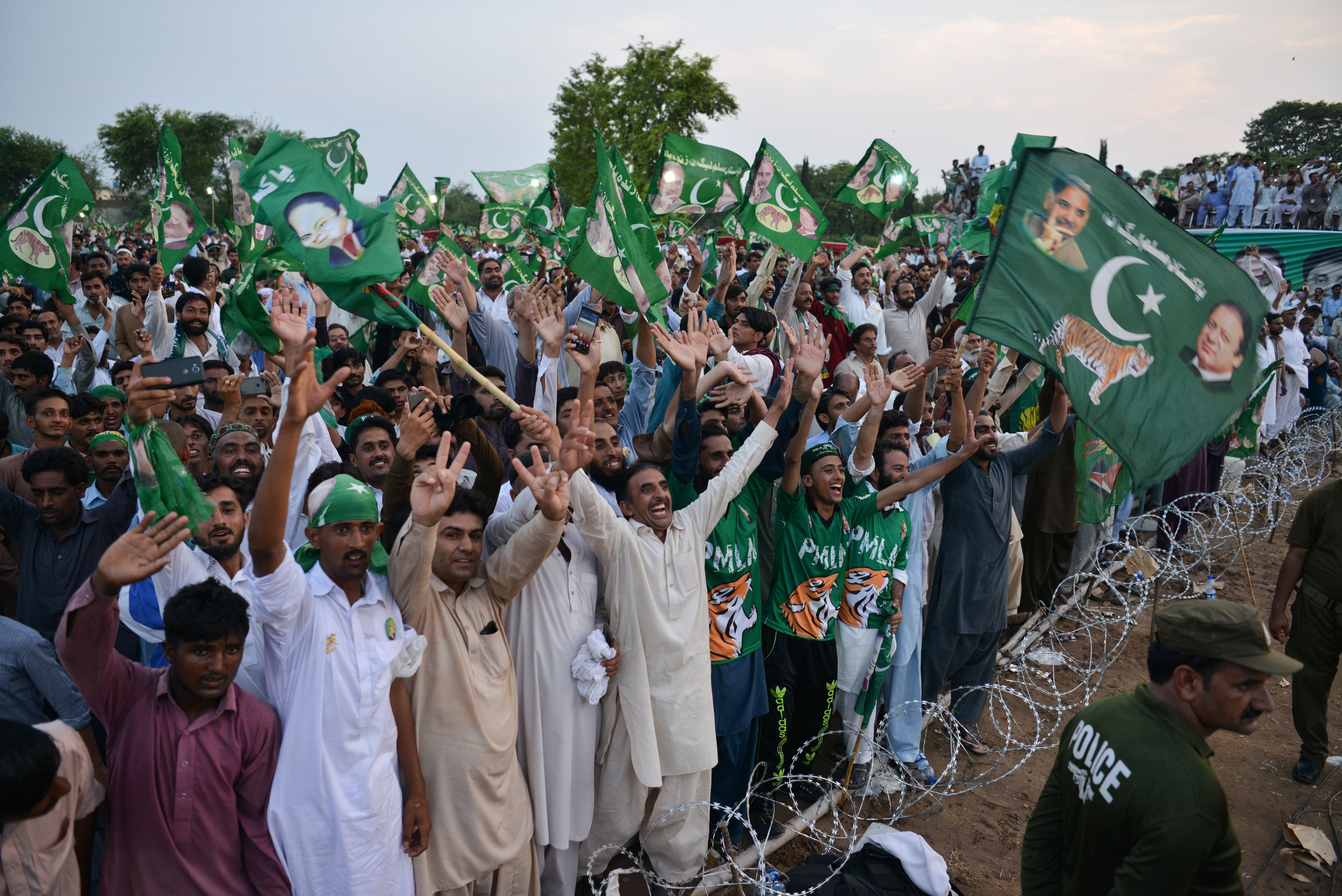 Supporters of Shabaz Sharif, the brother of ousted Pakistani Prime Minister Nawaz Sharif and the head of Pakistan Muslim League-Nawaz attend his campaign rally in Pindi Gheb, in the district of Attock, in the Punjab province, on July 19, 2018. (Aamir Quresh—AFP/Getty Images)