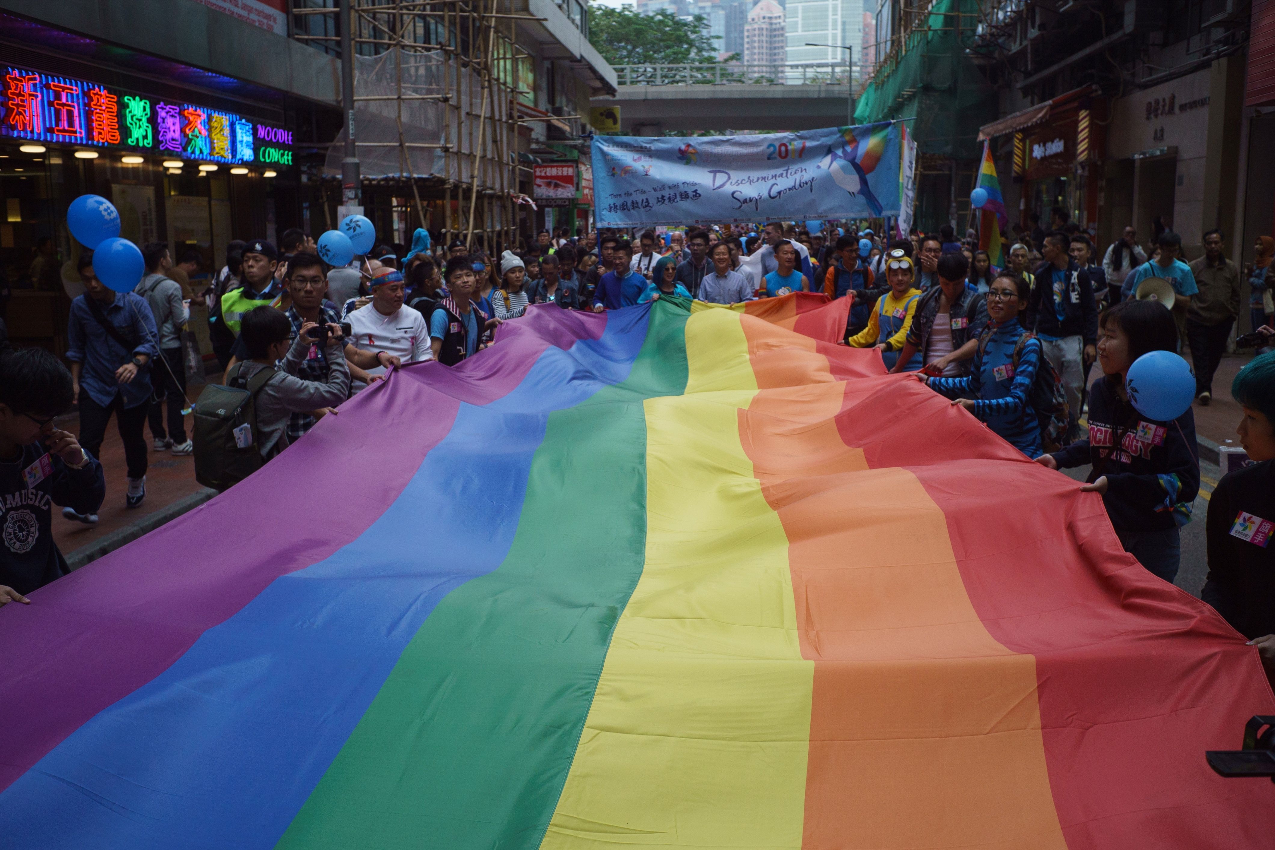 A giant rainbow flag is displayed during Hong Kong's annual pride parade on Nov. 25, 2017. (Aaron Tam—AFP/Getty Images)