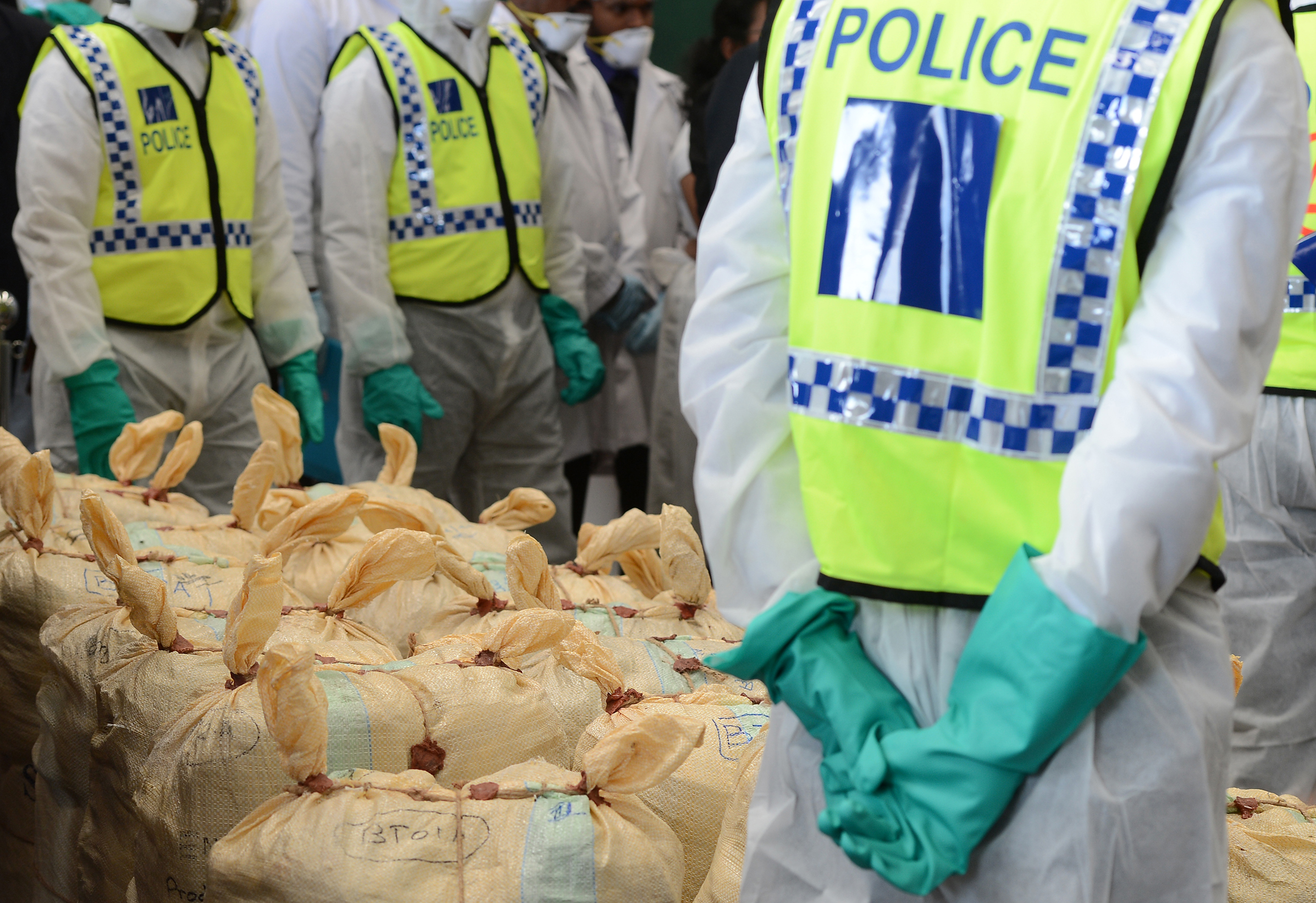 Sri Lankan police personnel prepare seized cocaine to be destroyed under judicial supervision in Katunayake on January 15, 2018. (Lakruwan Wanniarachchi—AFP/Getty Images)