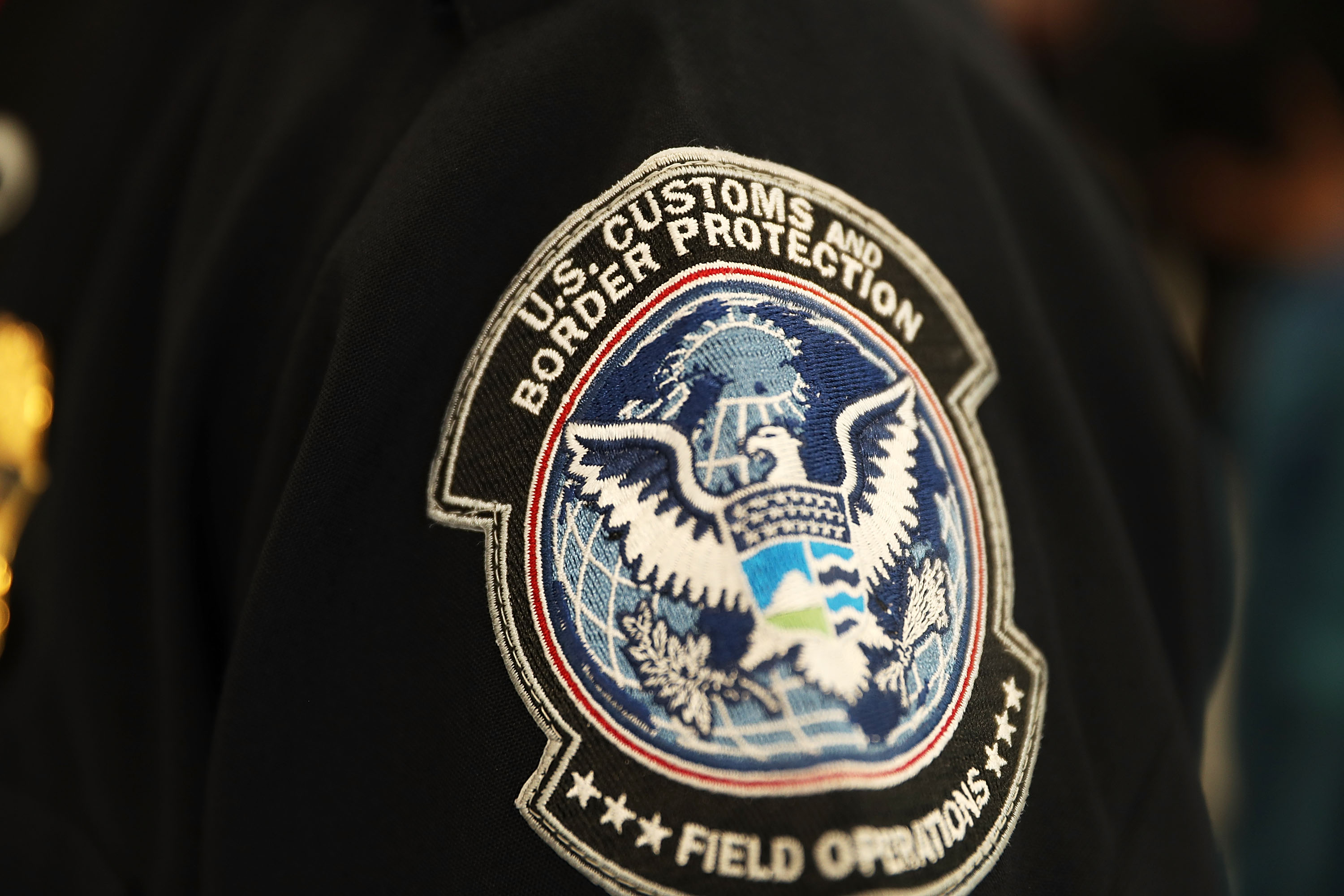 A patch is seen on the sleeve of a U.S. Customs and Border Protection officer at Miami International Airport on Feb. 27, 2018 in Miami, Florida. (Joe Raedle—Getty Images)