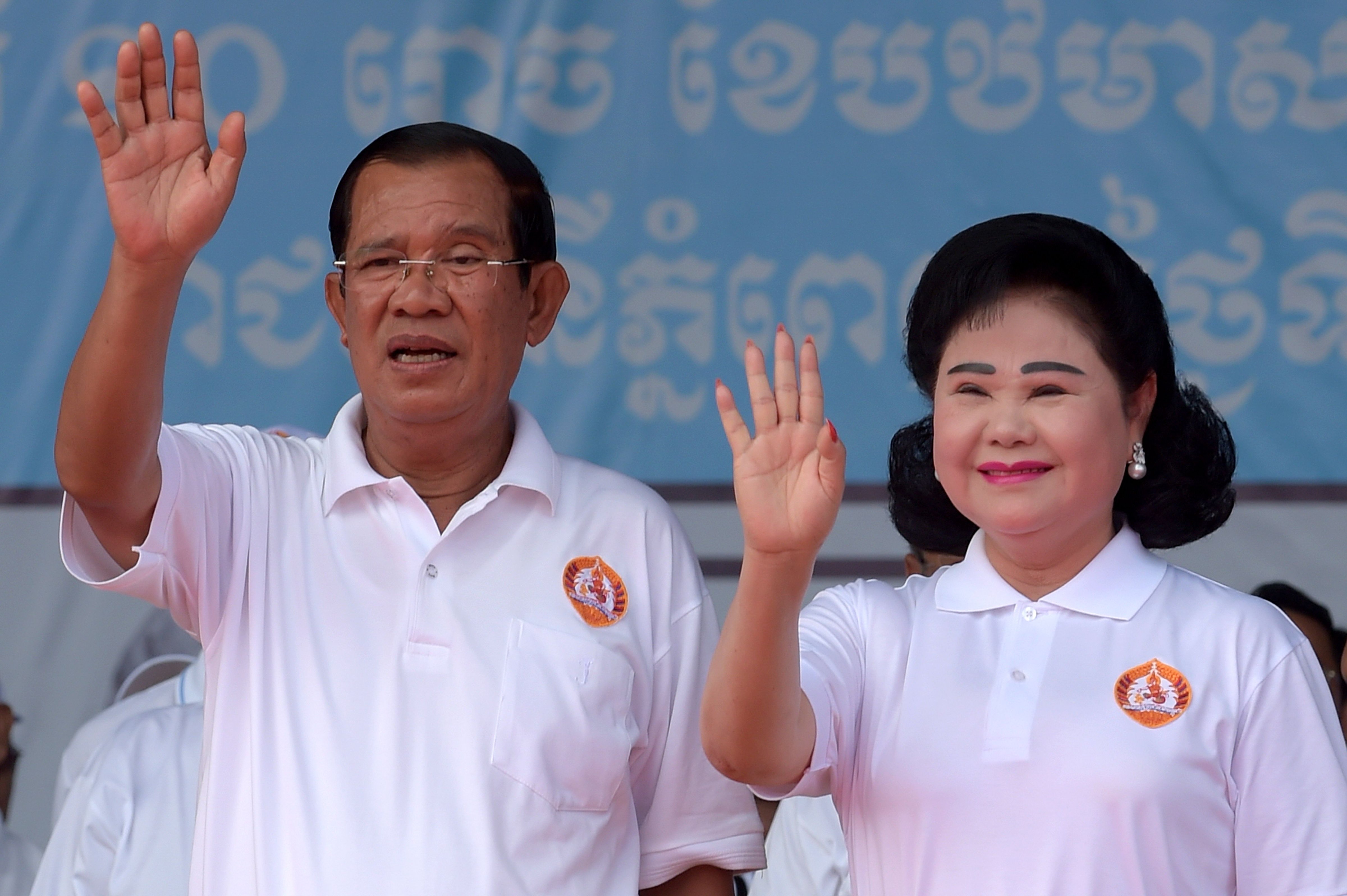 Hun Sen, Prime Minister and leader of the Cambodian People's Party and his wife Bun Rany during a general election campaign in Phnom Penh on July 7, 2018. (Tang Chhin Sothy—AFP/Getty Images)