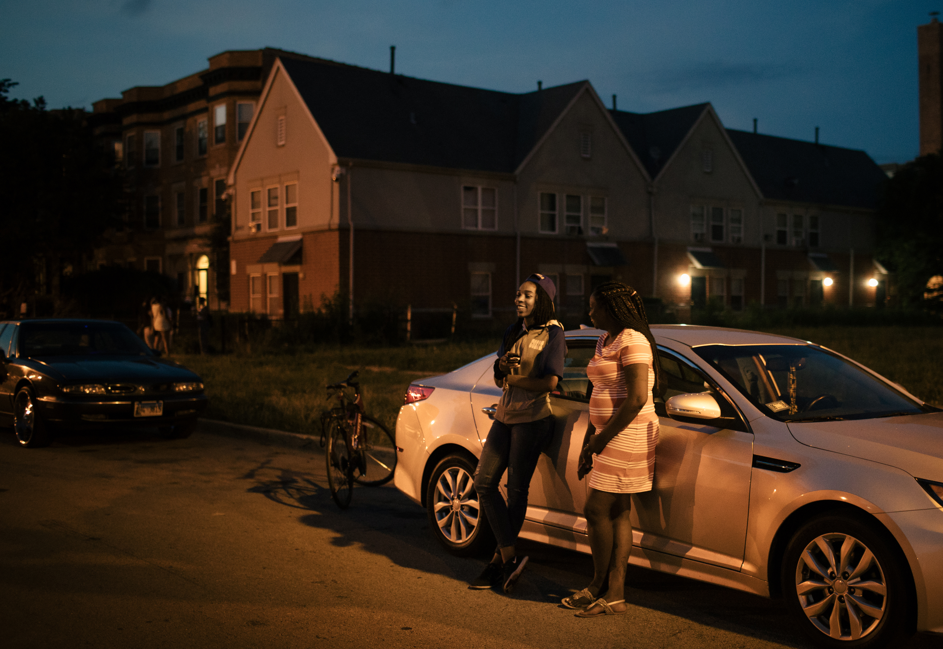 From left, Shawn-Tae, who asked to be identified only by her first name, and Sterling Okafor enjoy an evening together in the Woodlawn neighborhood on Chicago's South Side. (Alyssa Schukar for TIME)