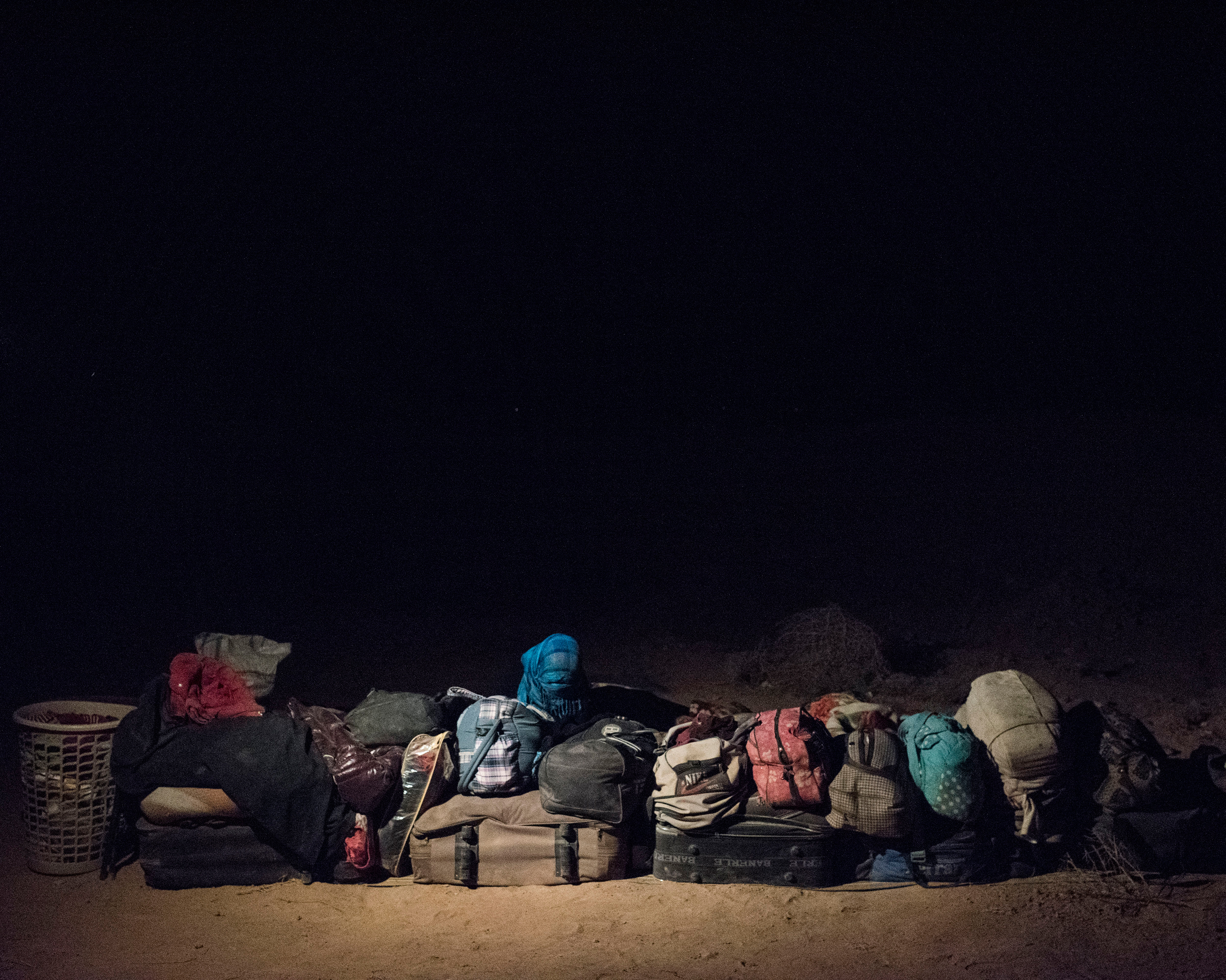 The belongings of refugees sleeping in the Syrian desert, on the outskirts of Deir ez-Zor. (Lorenzo Meloni—Magnum Photos)