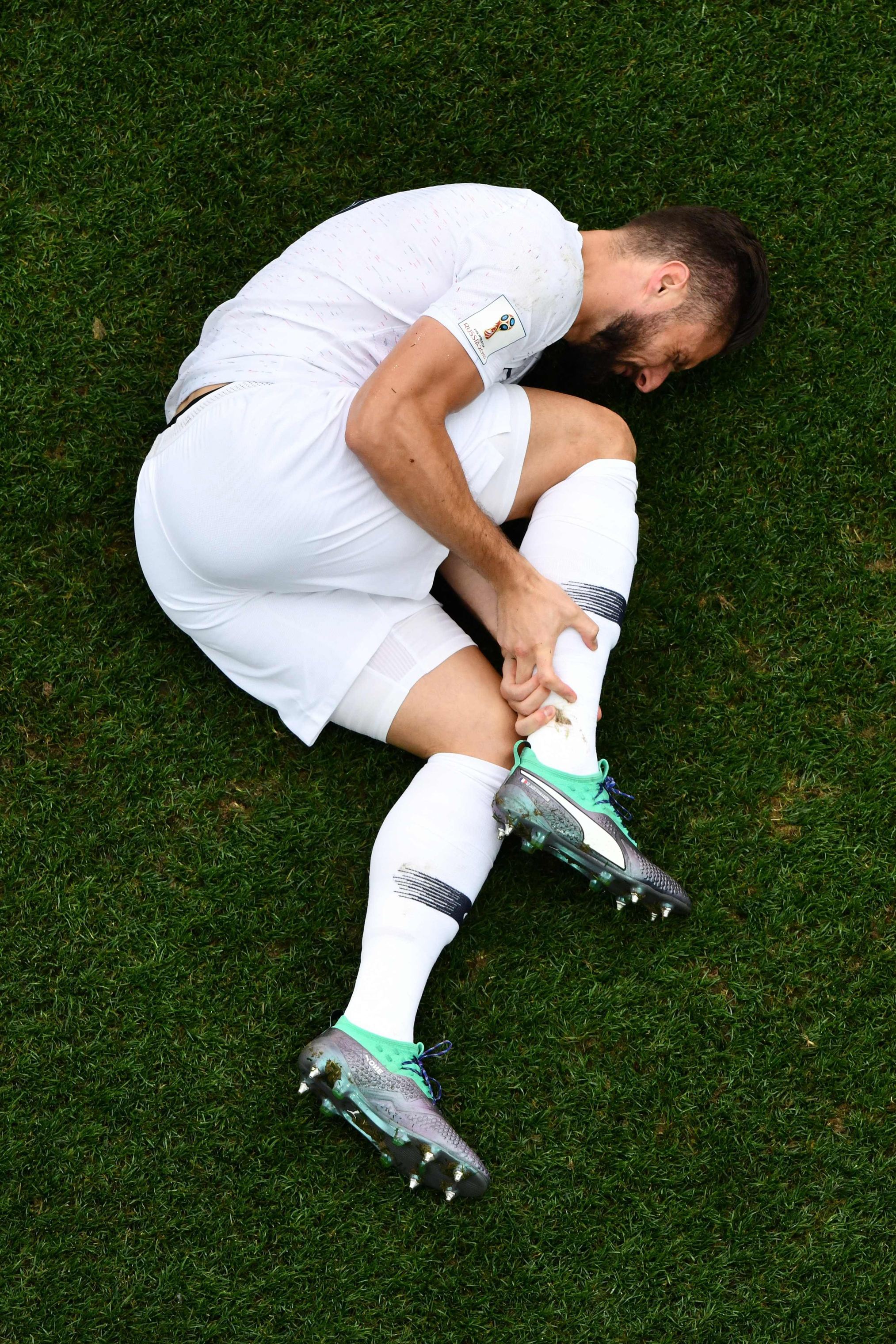 France's forward Olivier Giroud reacts after a challenge during the quarter-final football match between Uruguay and France on July 6, 2018. (Antonin Thulillier—AFP/Getty Images)