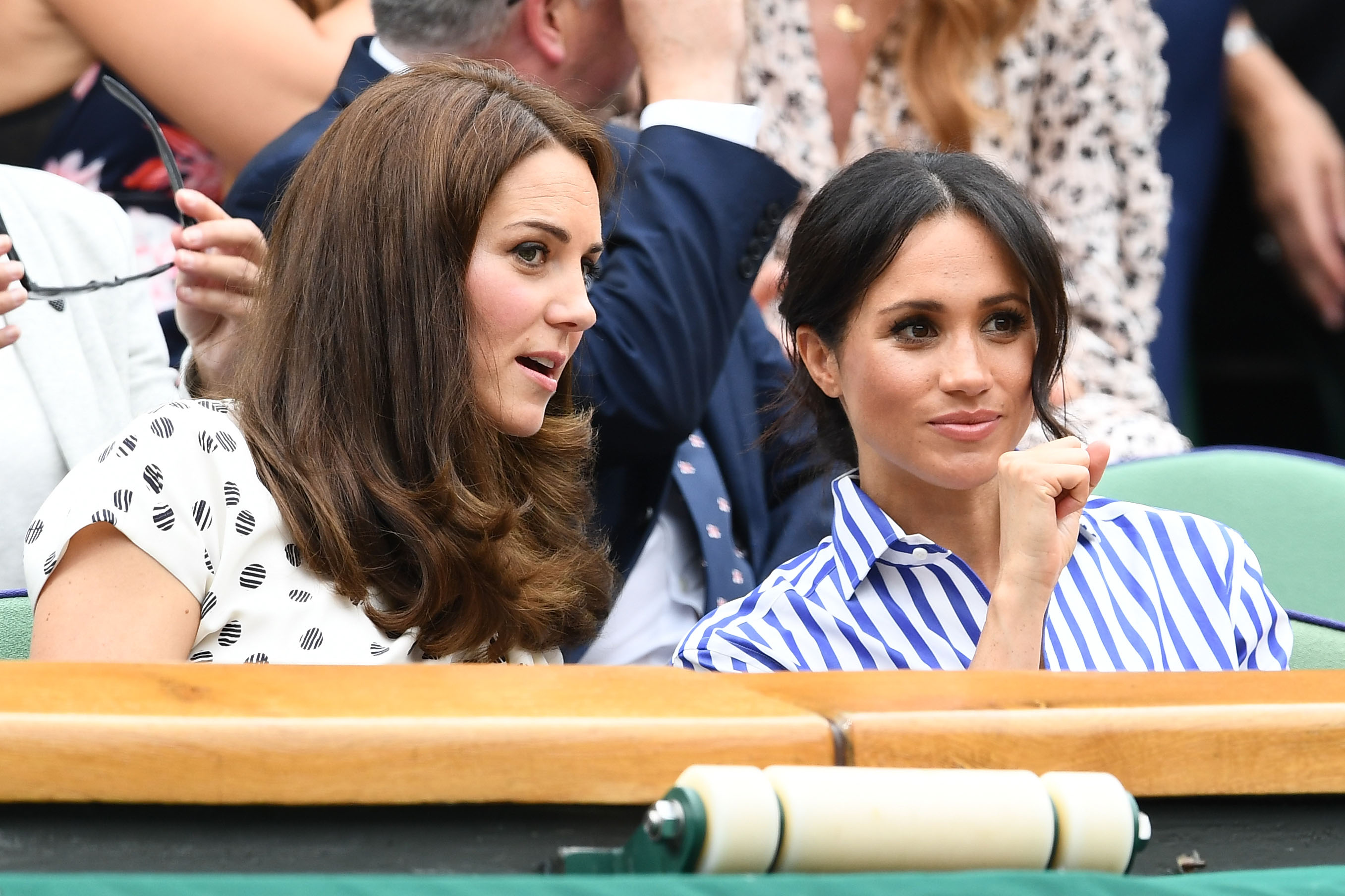 Catherine, Duchess of Cambridge and Meghan, Duchess of Sussex attend day twelve of the Wimbledon Lawn Tennis Championships at All England Lawn Tennis and Croquet Club on July 14 in London, England. (Clive Mason — Getty Images)