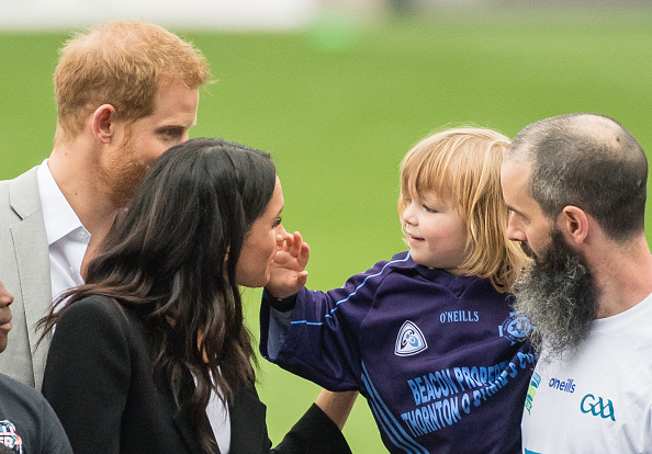 Prince Harry, Duke of Sussex and Meghan, Duchess of Sussex meet Walter Cullen, aged 3 at Croke Park, home of Ireland's largest sporting organisation, the Gaelic Athletic Association on July 11, 2018 in Dublin, Ireland. (Samir Hussein/Samir Hussein/WireImage)