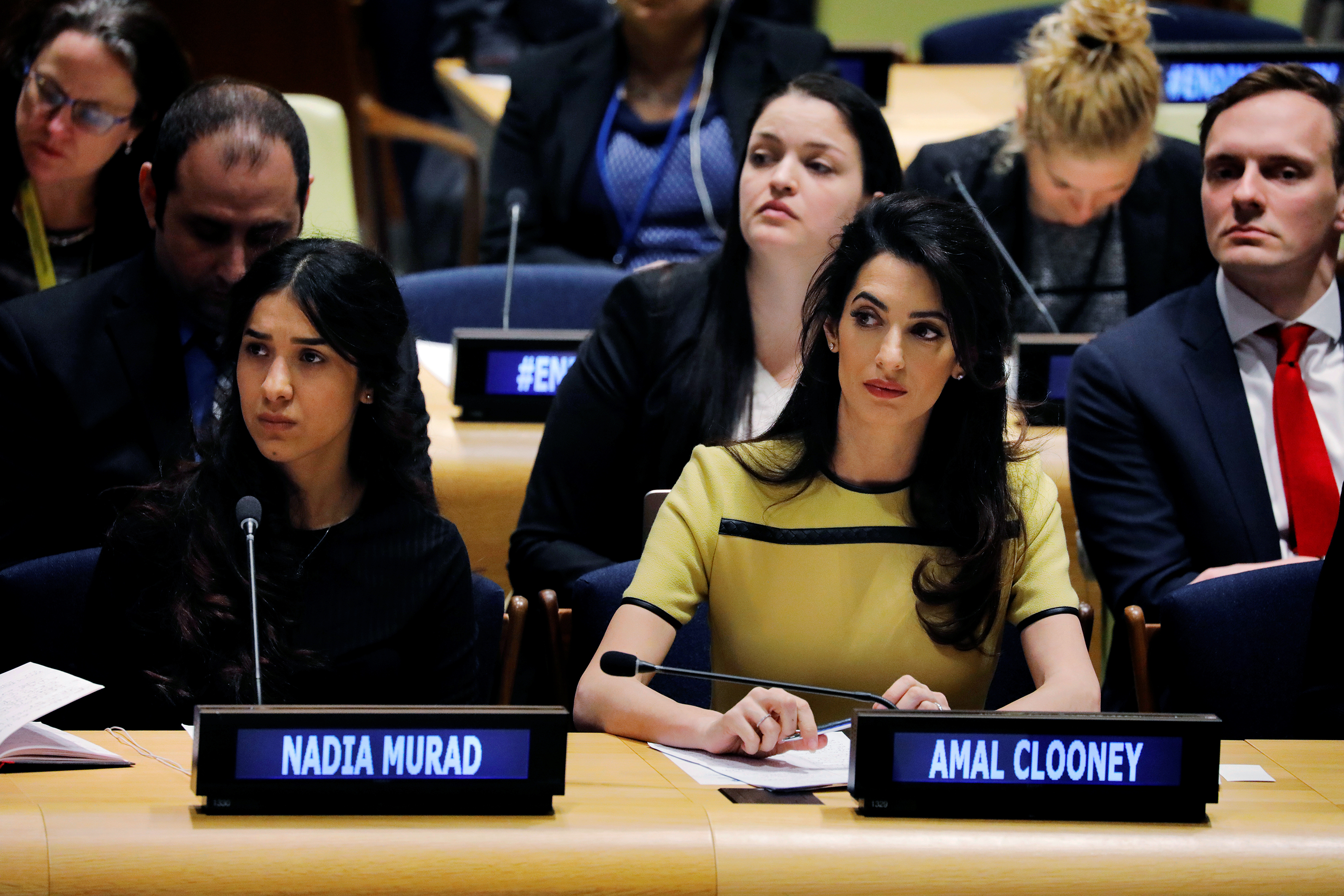 International human rights lawyer Amal Clooney sits with Murad as she waits to address a 