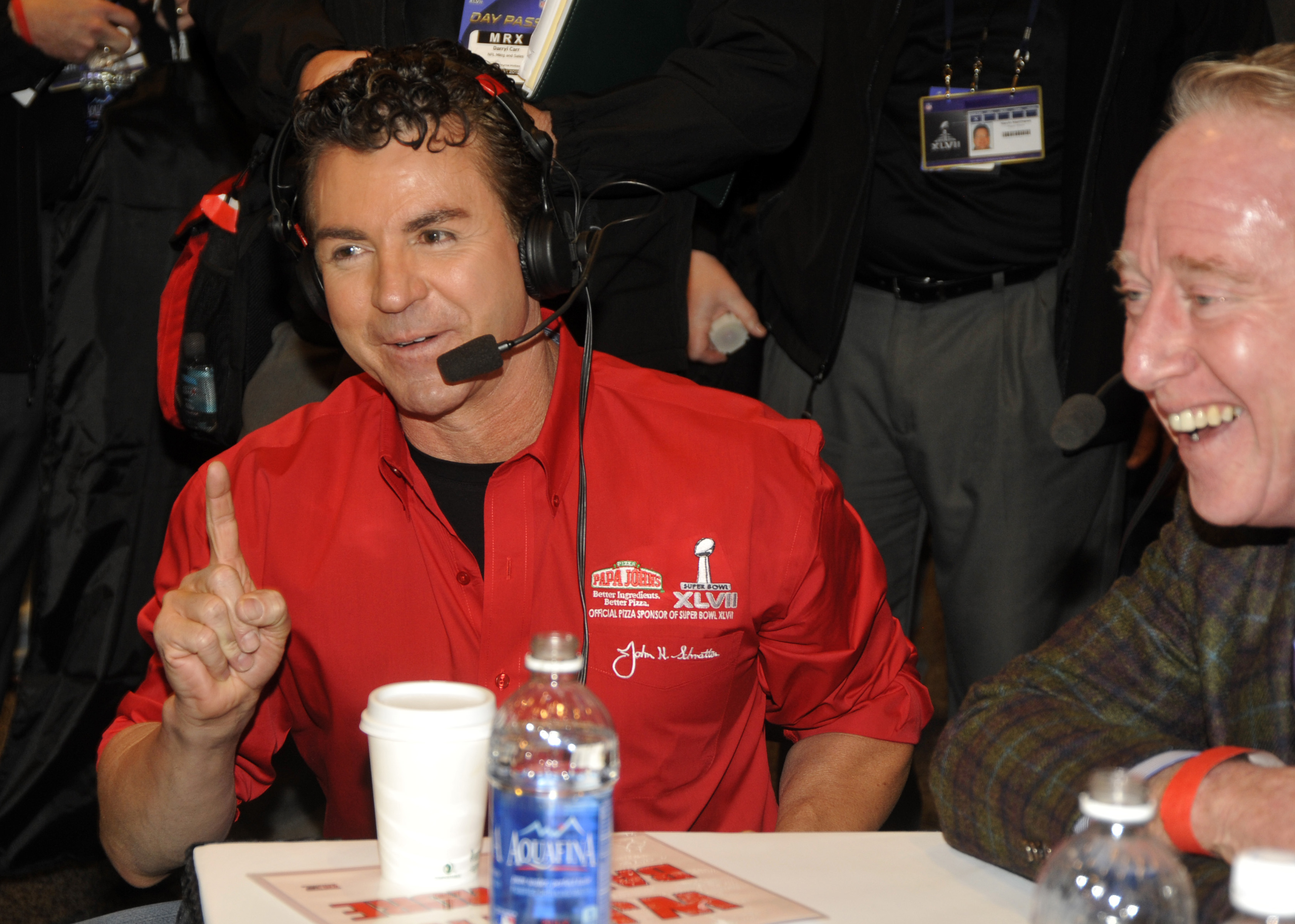Papa John's Founder, Chairman and CEO John Schnatter, left, and NFL legend Archie Manning, right, share a laugh at the NFL Media Center, promoting Papa John's Super Bowl XLVII Coin Toss Experience, in New Orleans. (Jack Dempsey/Invision/AP/REX/Shutterstock)