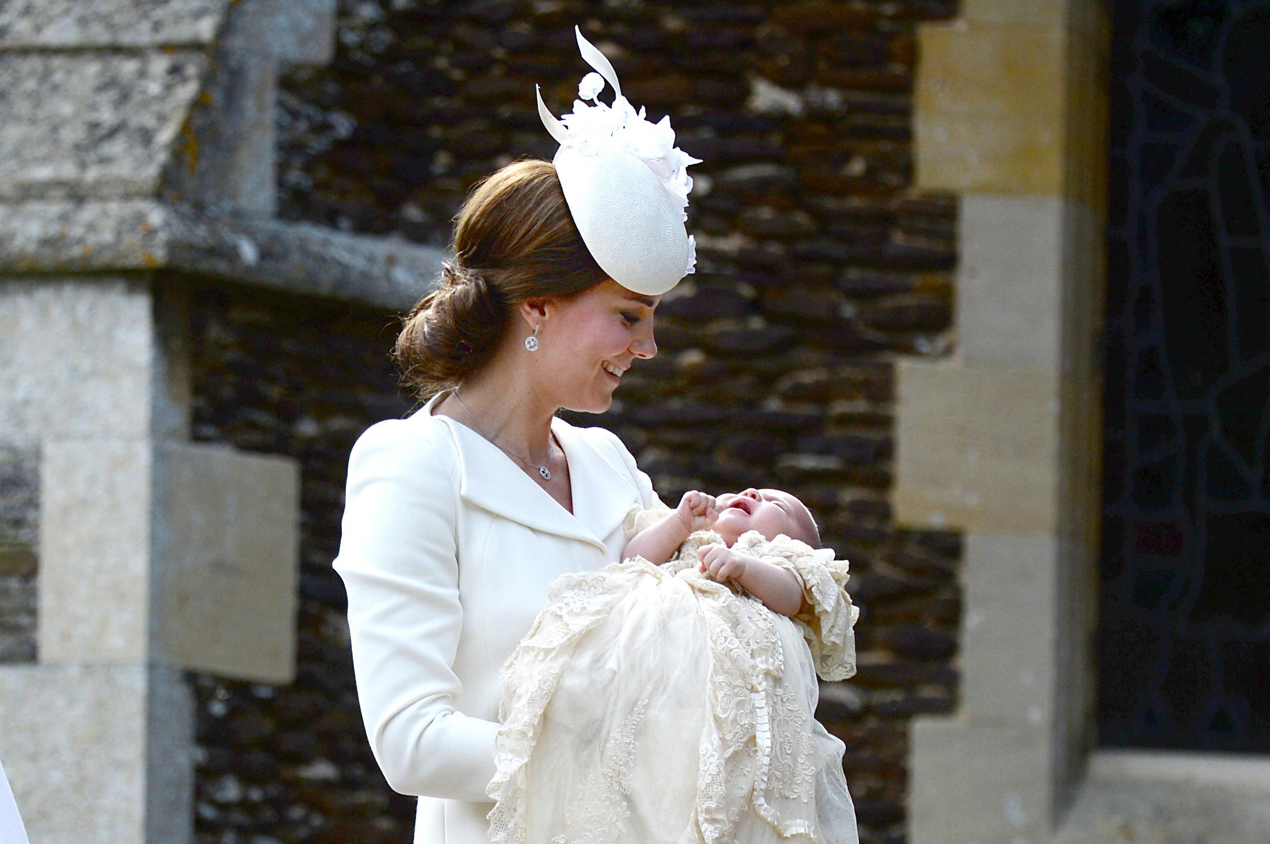 Catherine, Duchess of Cambridge and Princess Charlotte of Cambridge arrive at the Church of St Mary Magdalene on the Sandringham Estate for the Christening of Princess Charlotte on July 5, 2015. (WPA Pool—Getty Images)