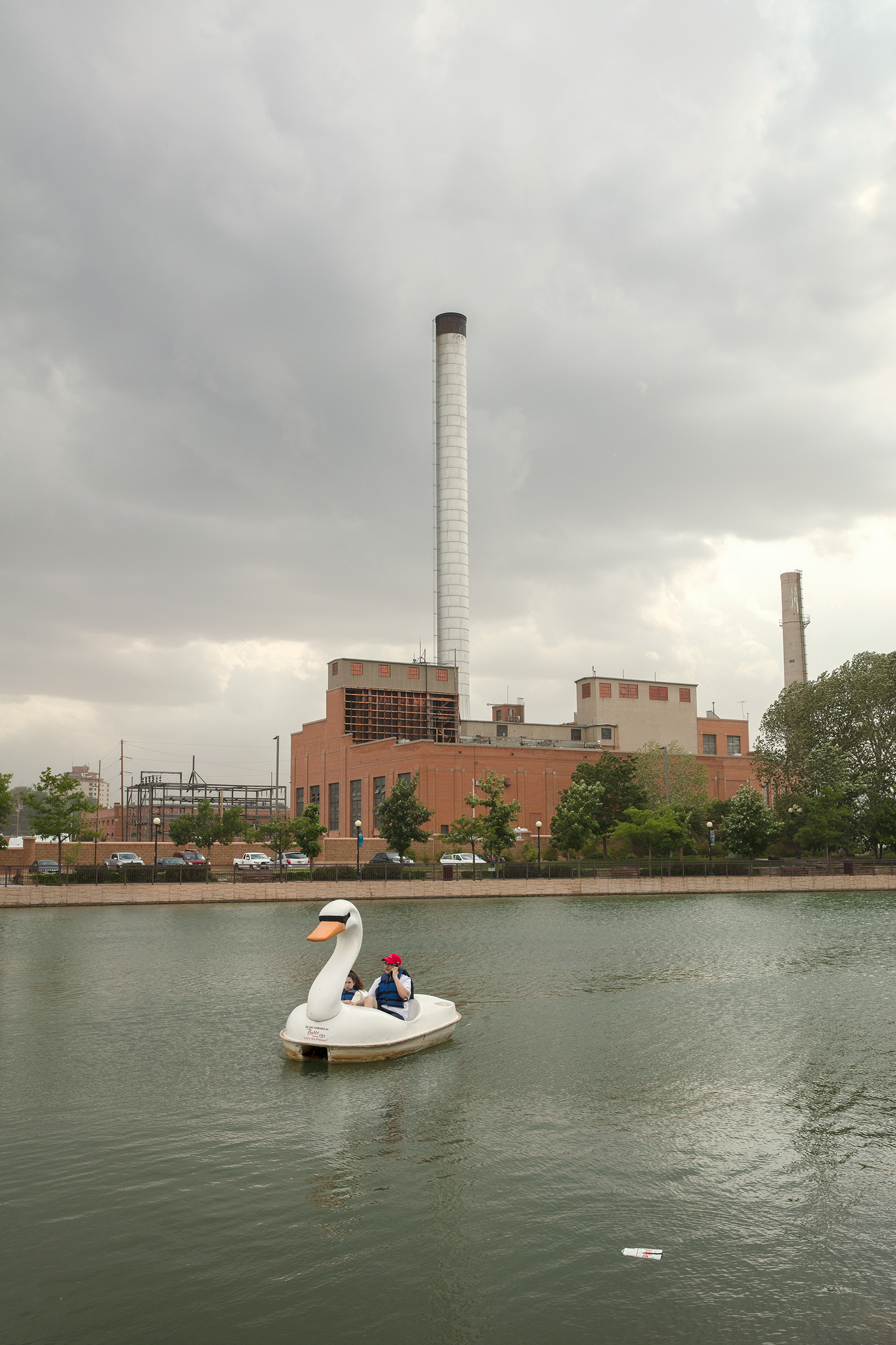 A defunct power plant, once operated by Black Hills Energy, looms over Pueblo’s Riverwalk (Jamie Kripke for TIME)