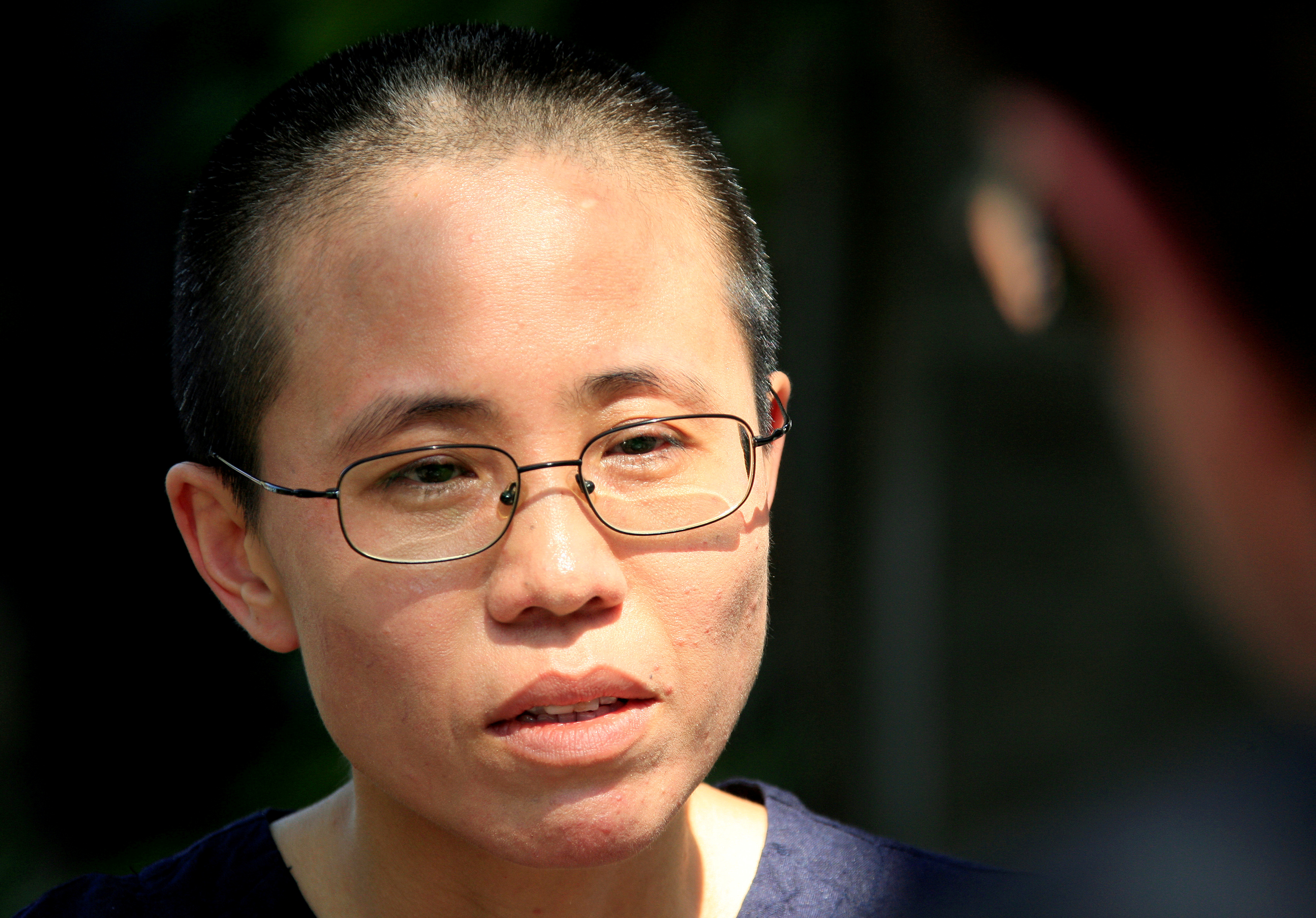 Liu Xia, wife of veteran Chinese pro-democracy activist Liu Xiaobo, listens to a question during an interview in Beijing June 24, 2009. (David Gray—Reuters)