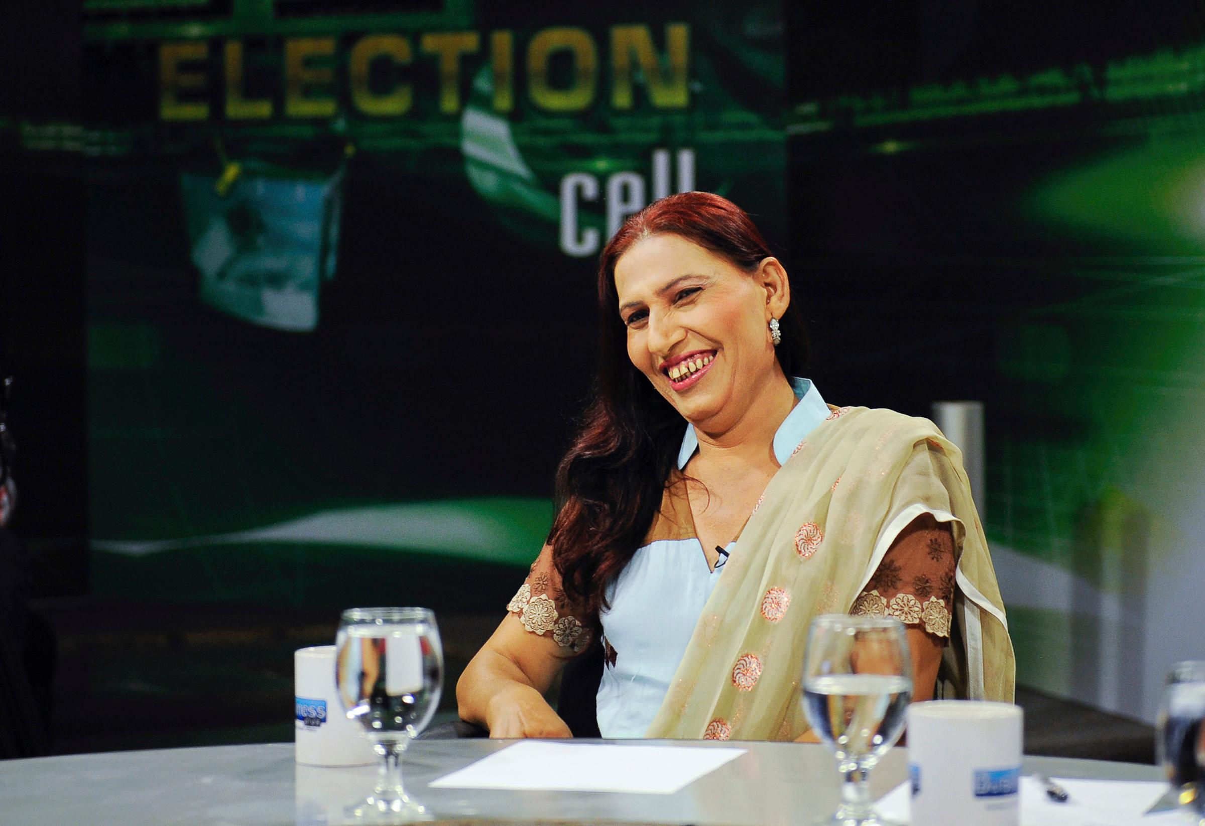 Rana, a transgender independent candidate for the upcoming elections, smiles during a local TV programme in Karachi