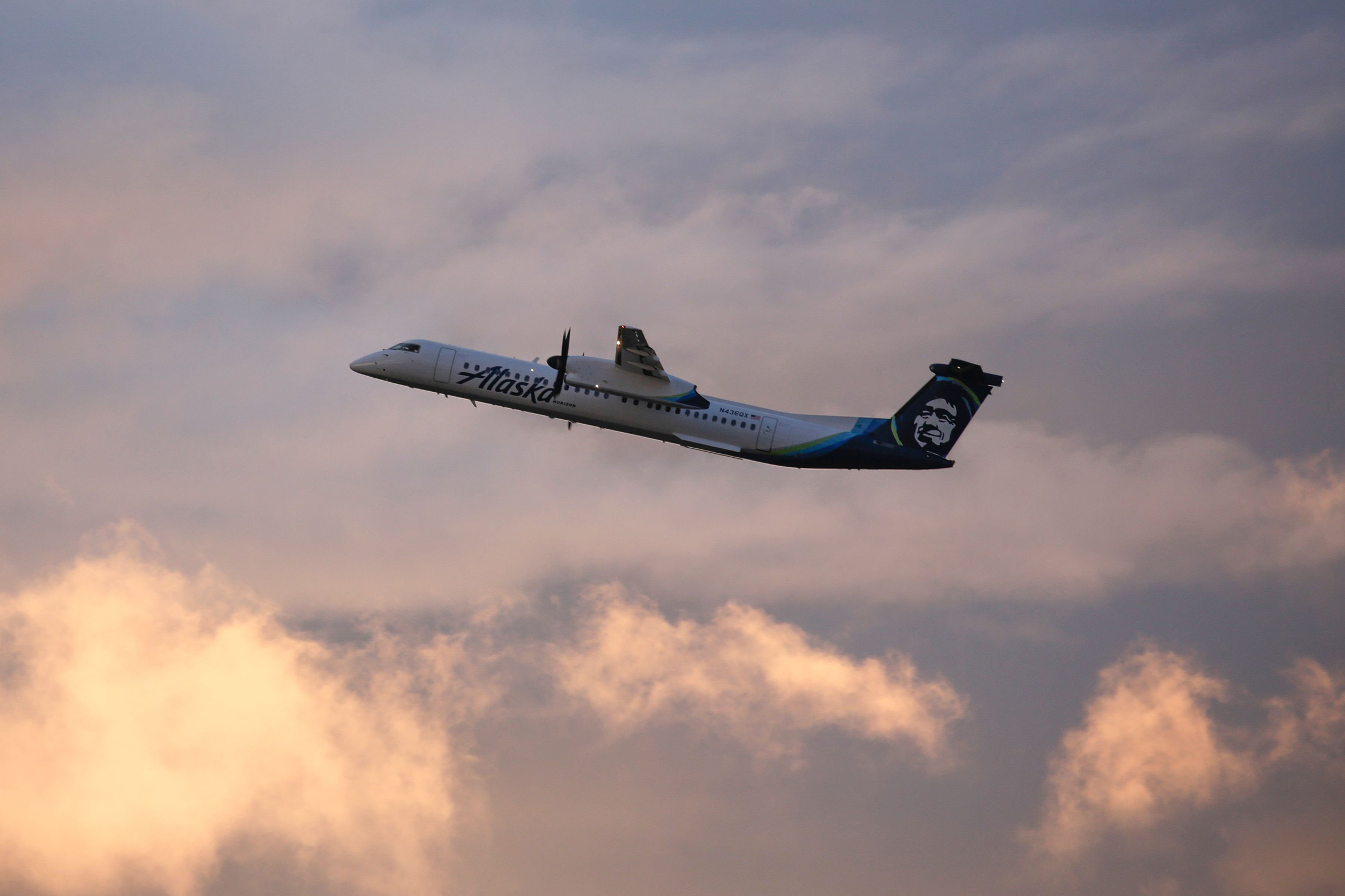 An Alaska Airlines Bombardier Dash 8 Q400 operated by Horizon Air takes off from at Seattle-Tacoma International Airport International Airport one day after Horizon Air ground crew member Richard Russell took a similar plane from the airport in Seattle, Washington on August 11, 2018. (Jason Redmond—AFP/Getty Images)