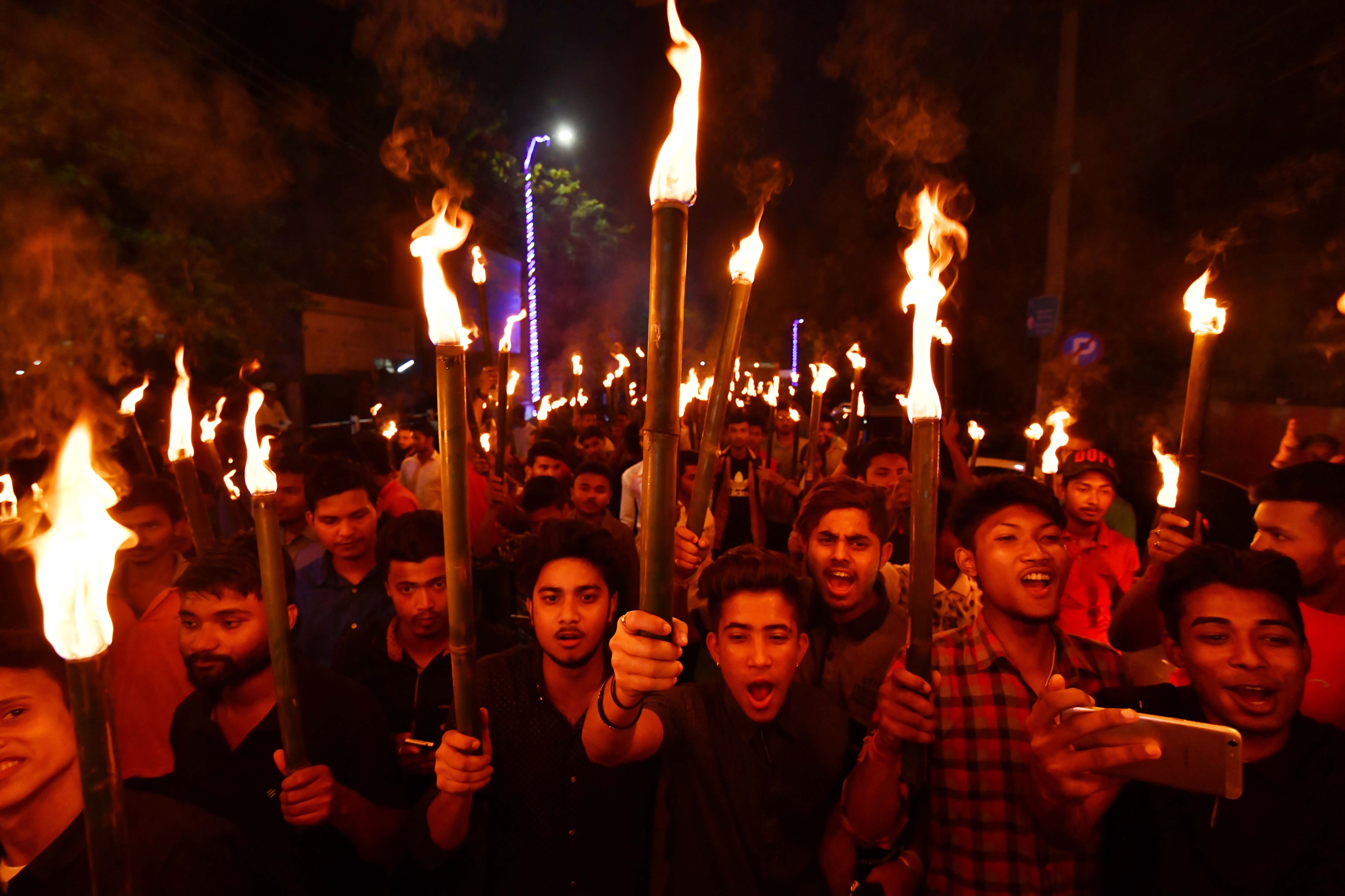 Activists of All Assam Students' Union (AASU) take part in a torch light procession in protest against the Citizenship (Amendment) Bill 2016 proposal to provide citizenship or stay rights to minorities from Bangladesh, Pakistan and Afghanistan in India, in Guwahati on May 14, 2018. (Biju Boro—AFP/Getty Images)