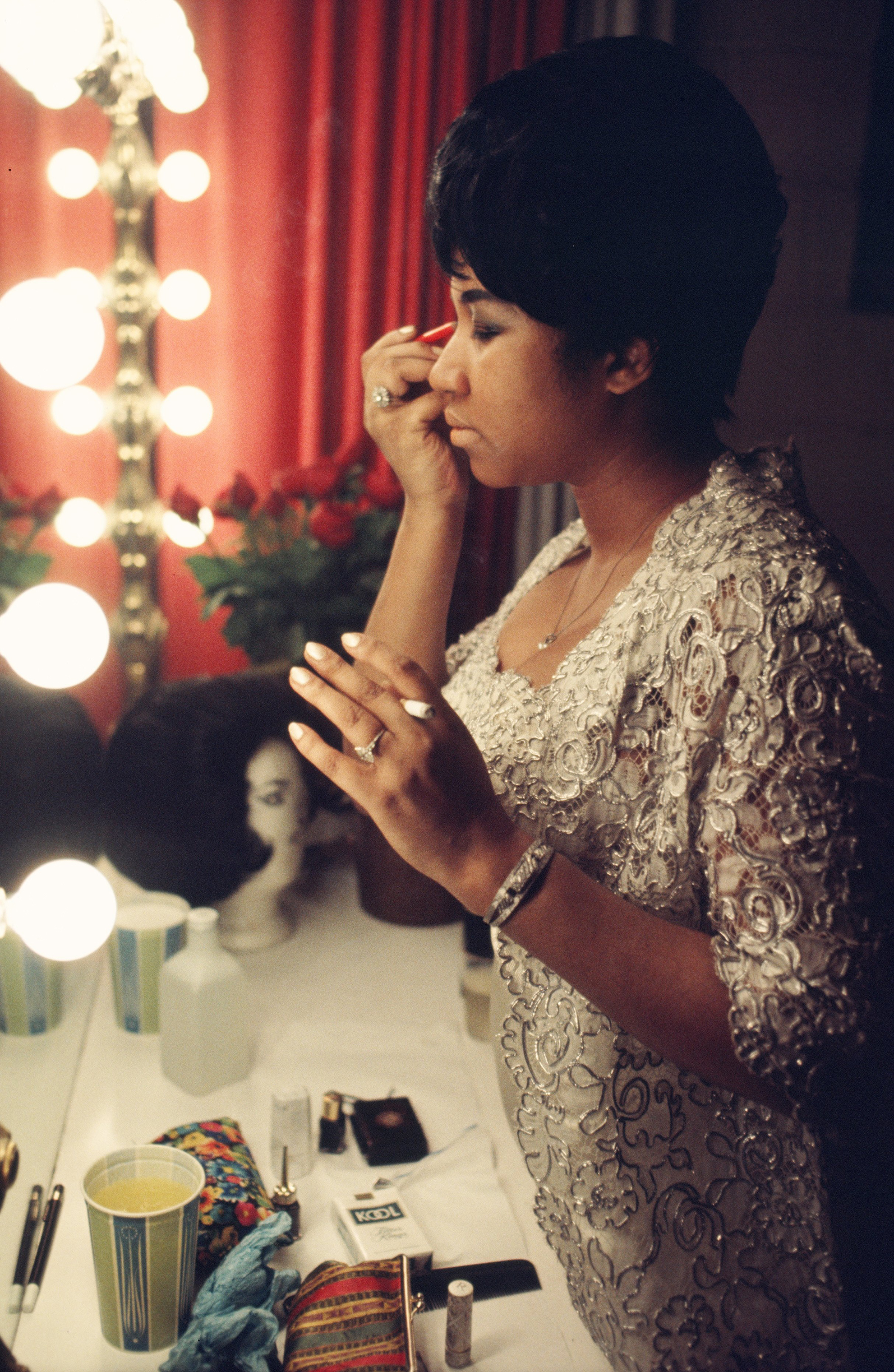 Aretha Franklin fixes her makeup backstage before a performance at Symphony Hall in 1969, Newark. (Walter Iooss—Getty Images)