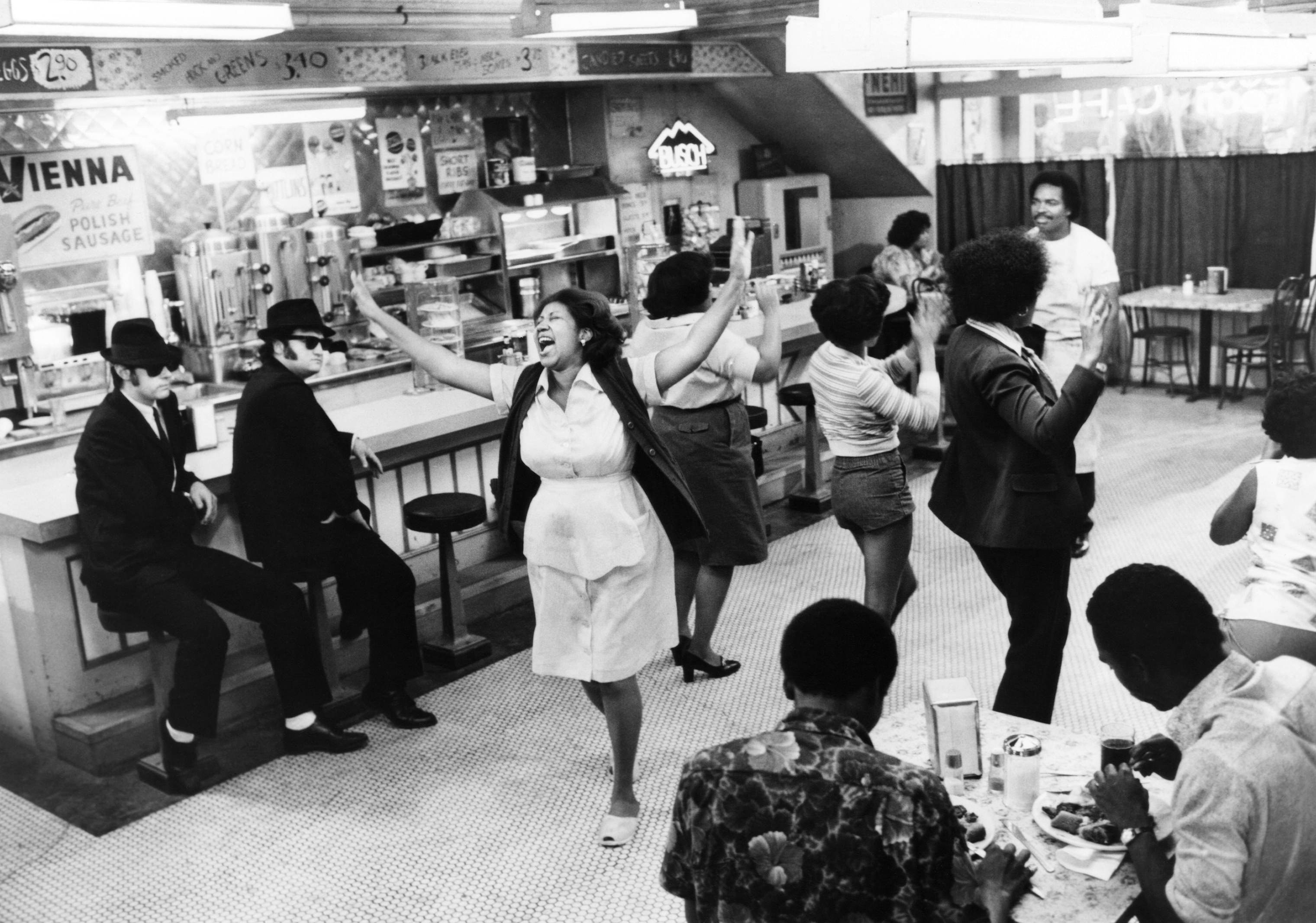 Aretha Franklin, center, lip-synchs her song Think for the 1980 film The Blues Brothers, starring Dan Aykroyd, far left, John Belushi, second left, and Matt Murphy, back right. (Universal/Everett Collection)
