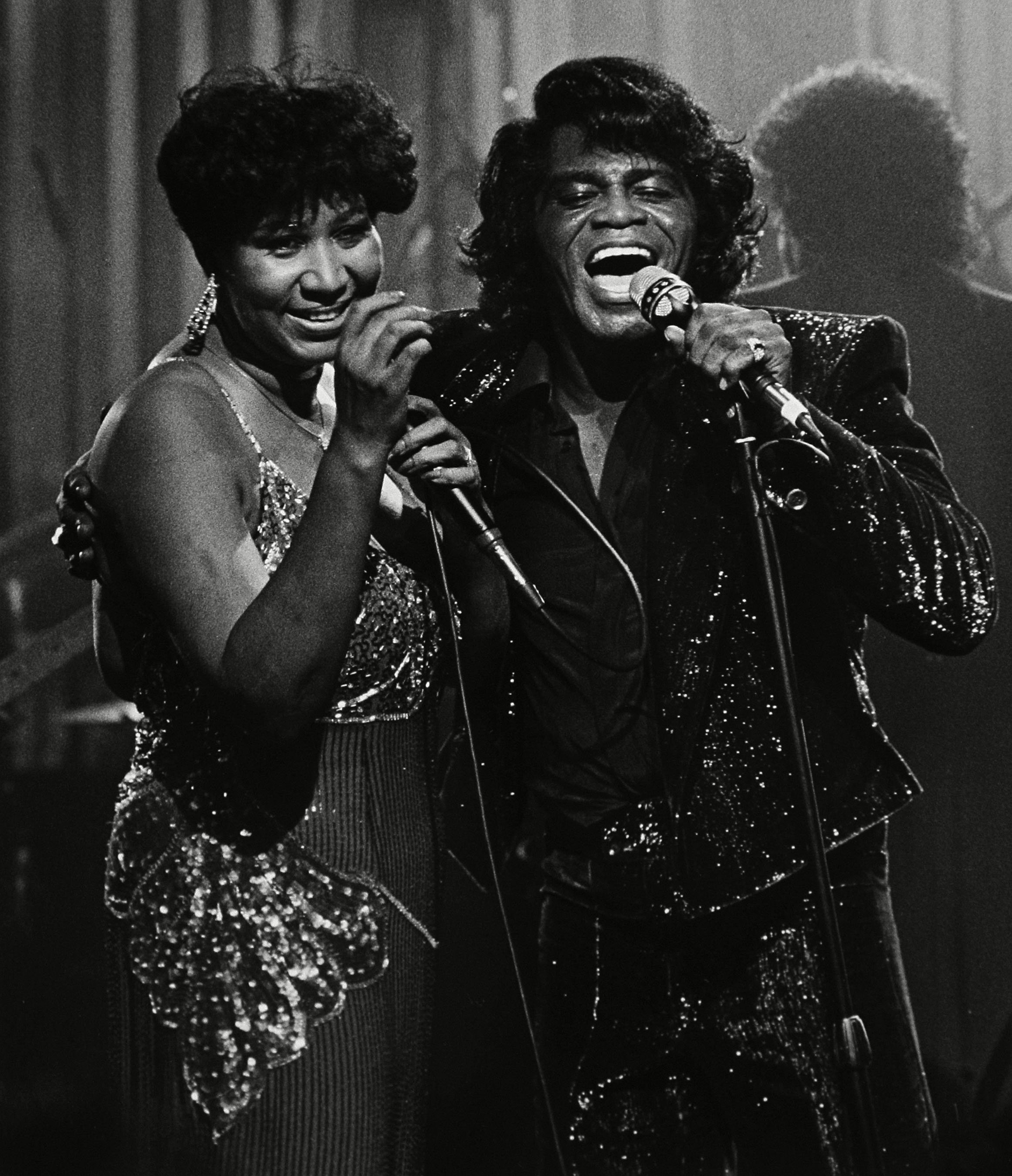 Aretha Franklin performs with James Brown during a Home Box Office taping at the Taboo night club in Detroit. (Joe Kennedy—AP/Shutterstock)