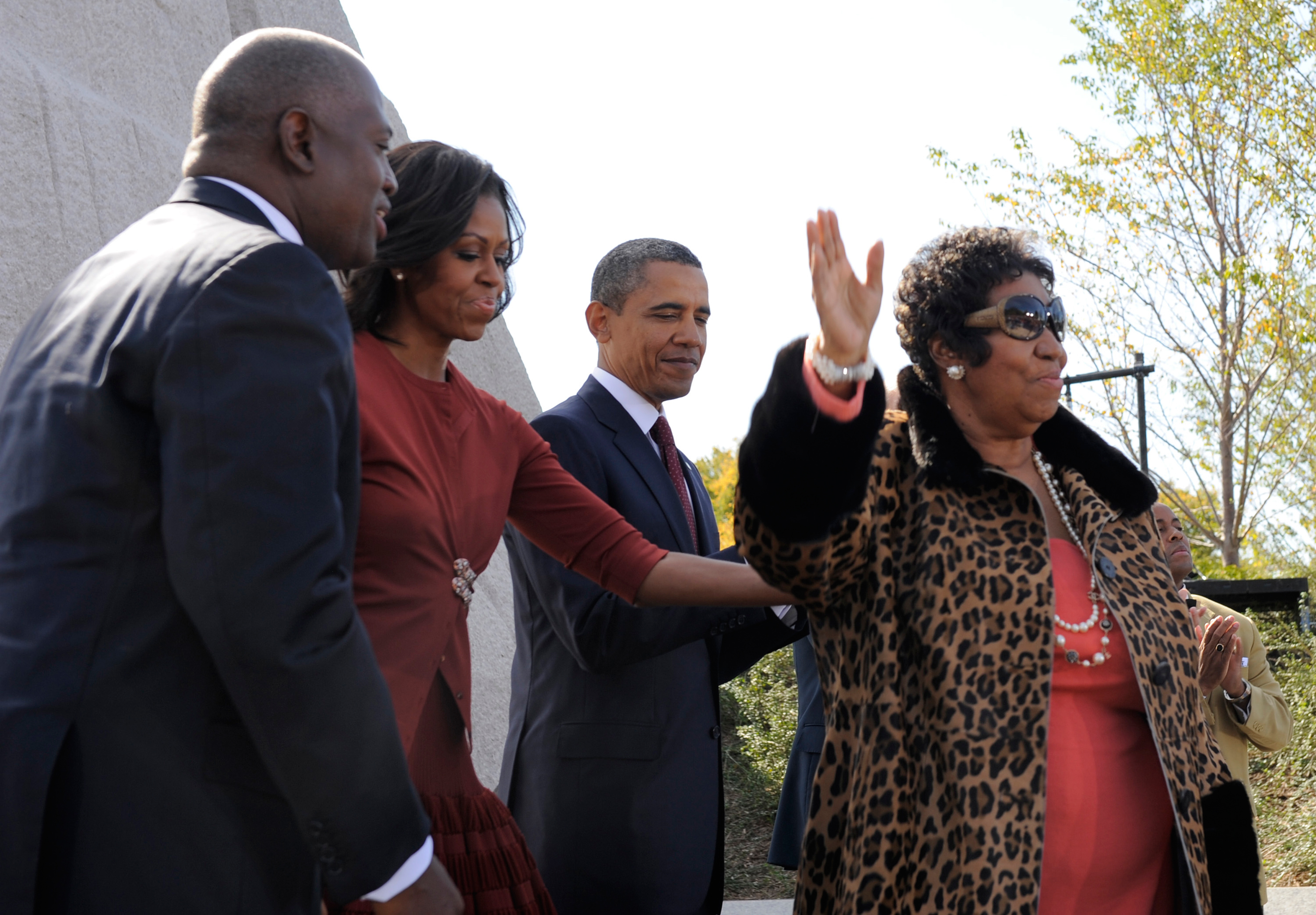 Aretha Franklin, right, finishes her performance with President Barack Obama, first lady Michelle Obama and Harry Johnson, president and CEO of the MLK National Memorial Project Fund as they attend the dedication of the Martin Luther King, Jr. Memorial on the National Mall Oct. 16, 2011 in Washington, DC. (Mike Theiler—Pool/Getty Images)