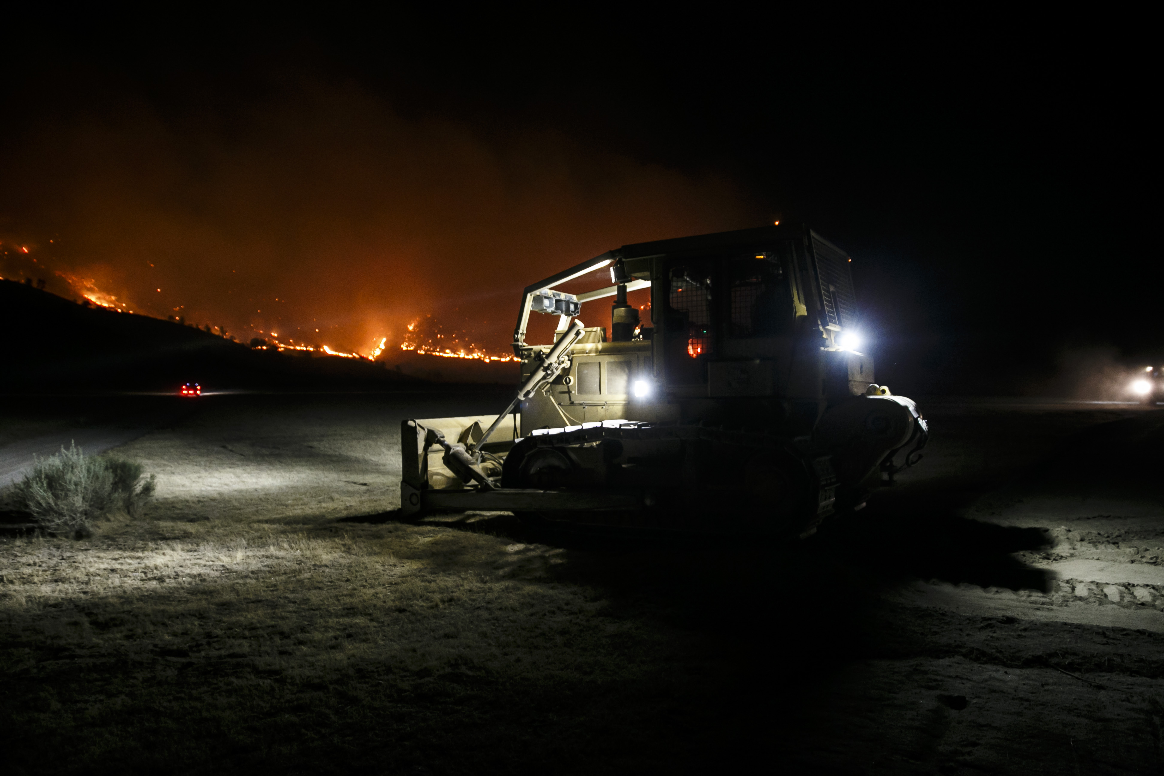 Bulldozers clear a fire break in Kelso Valley, at the head of the wildfire, near Lake Isabella, Calif., on June 24, 2016. (Marcus Yam&mdash;LA Times via Getty Images)