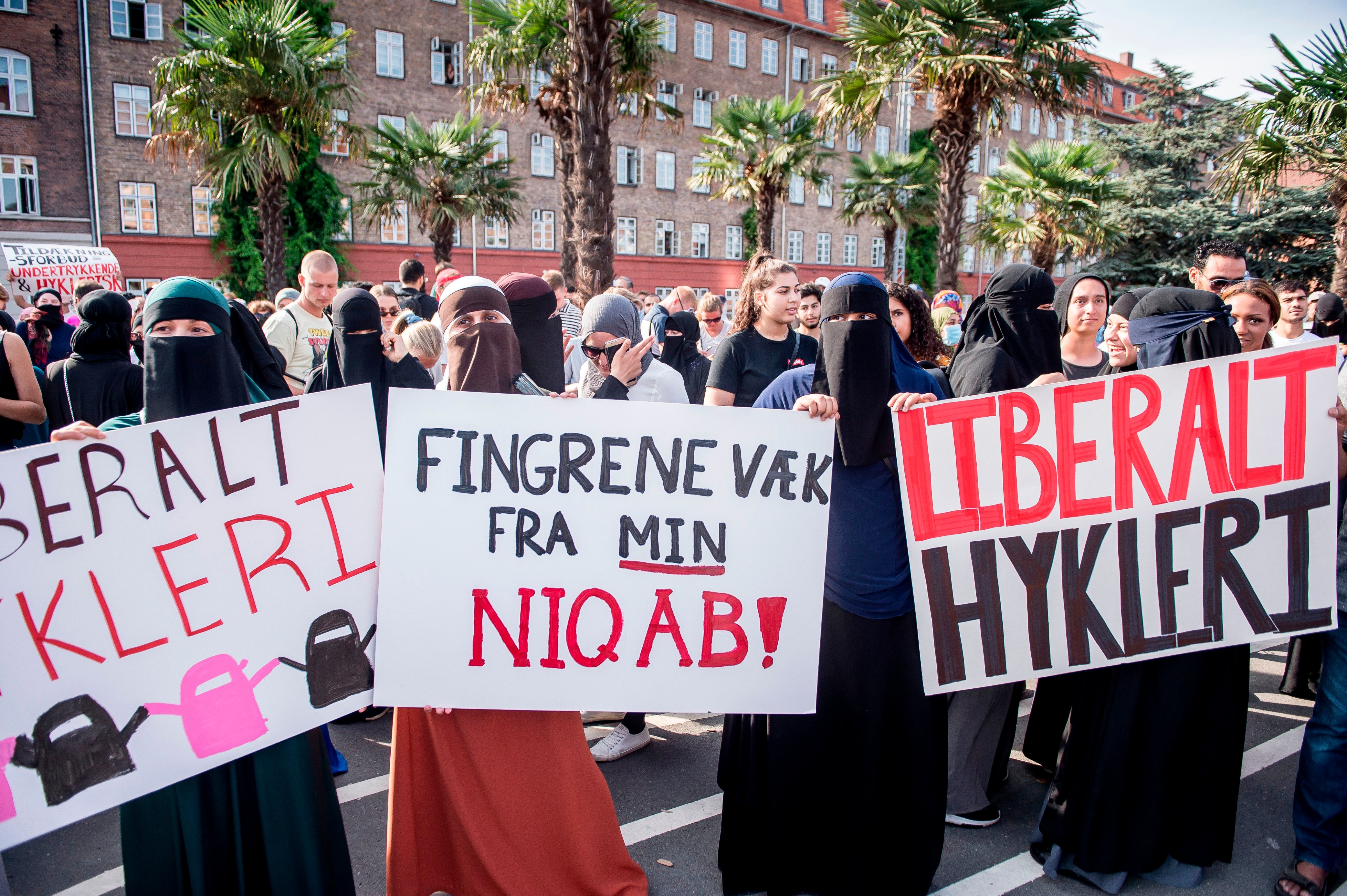 Women wearing niqabs to veil their faces take part in a demonstration on August 1, 2018, the first day of the implementation of the Danish face veil ban, in Copenhagen, Denmark. (Mads Claus Rasmussen—AFP/Getty Images)