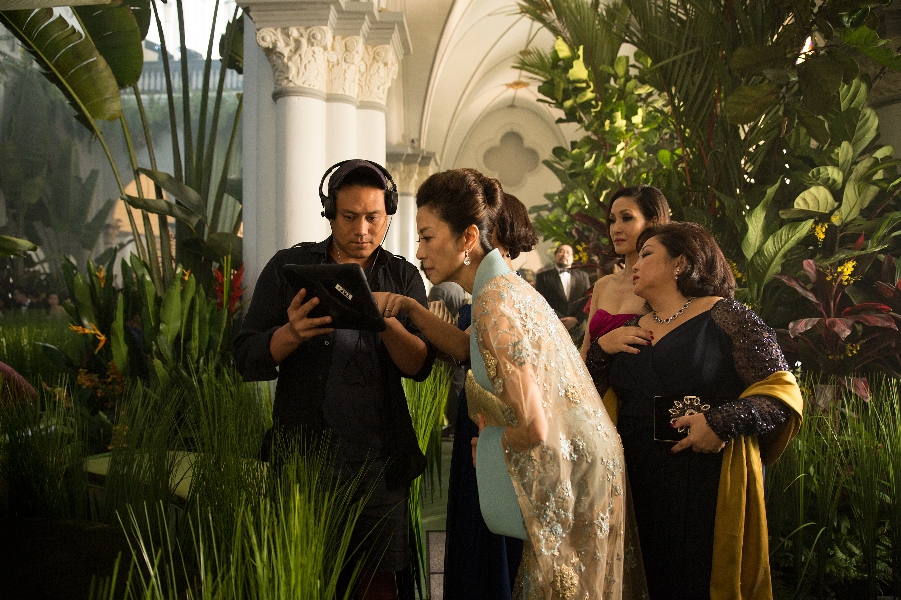 Michelle Yeoh (center) worked with Jon M. Chu (left) to add dimension to her character: “Where she was coming from—that was the most important thing for me.” (Sanja Bucko—Warner Bros.)