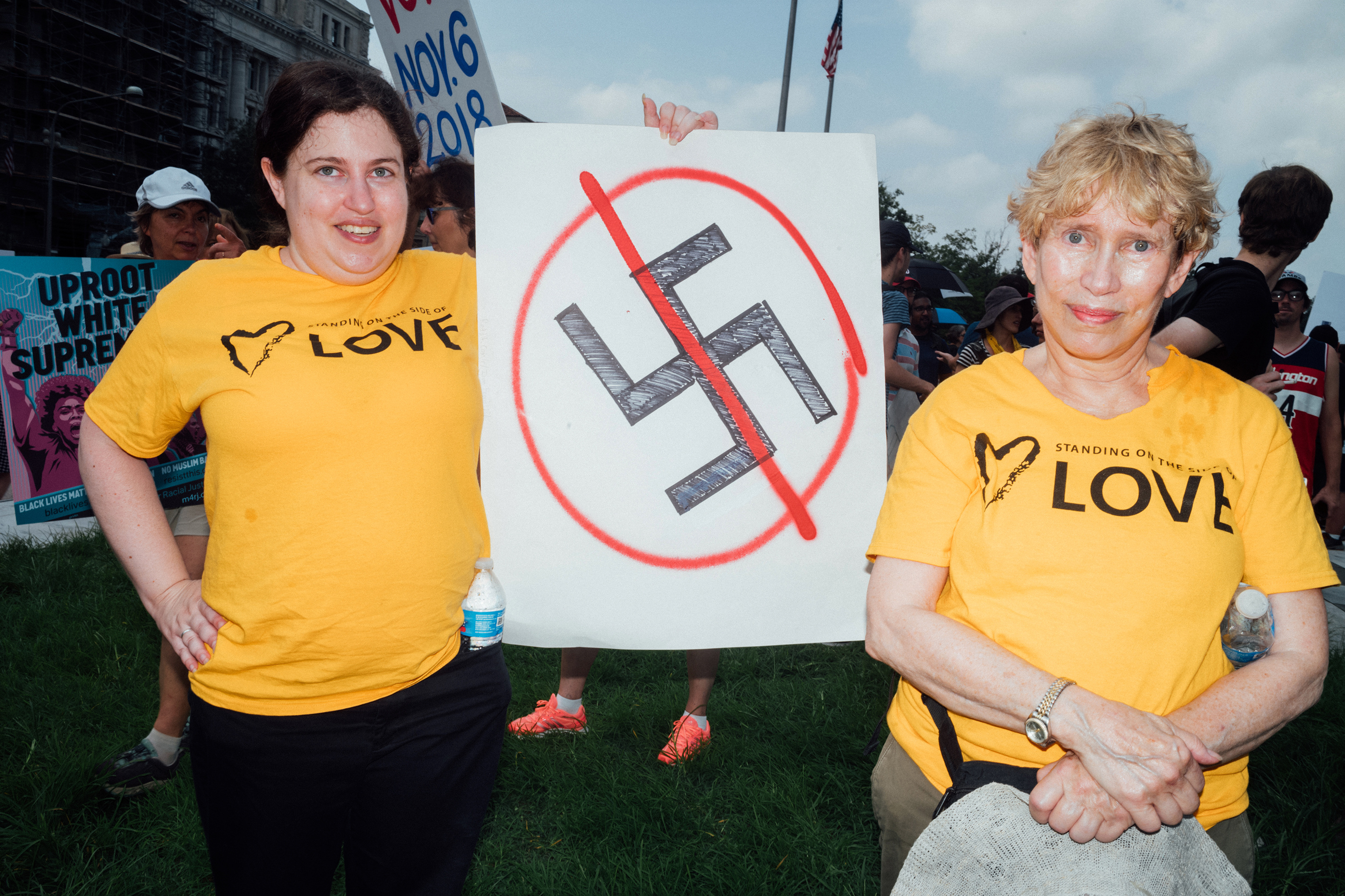 Two counter-protesters attend a demonstration, in opposition of the Unite the Right 2 rally, at Freedom Plaza. (Daniel Arnold for TIME)