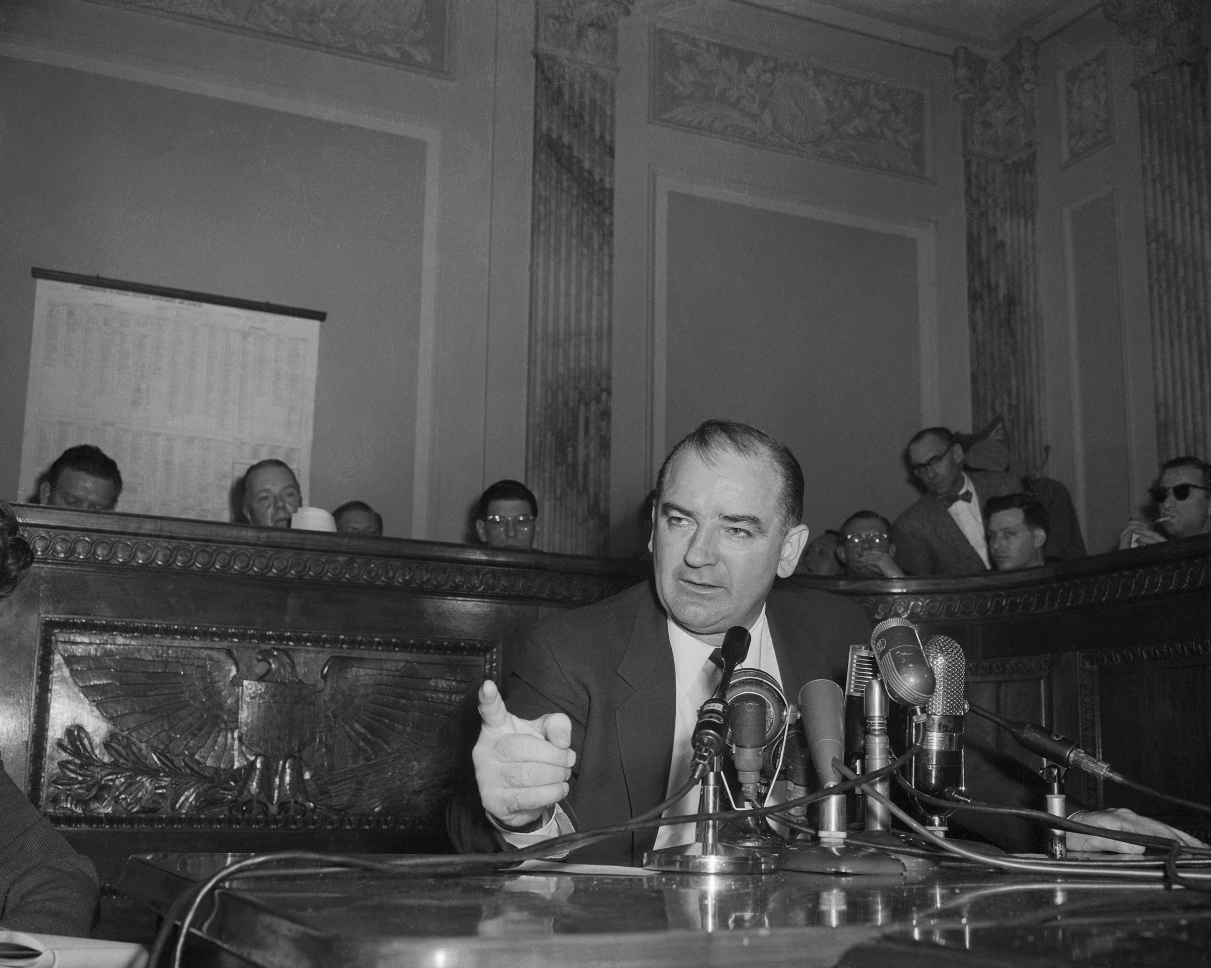 Senator Joseph R. McCarthy, chairman of the Government Committee on Operations of the Senate, comments on the latest developments in his dispute with the White House and Arm Secretary Robert T. Stevens on Feb 26, 1954. (Bettmann Archive/Getty Images)