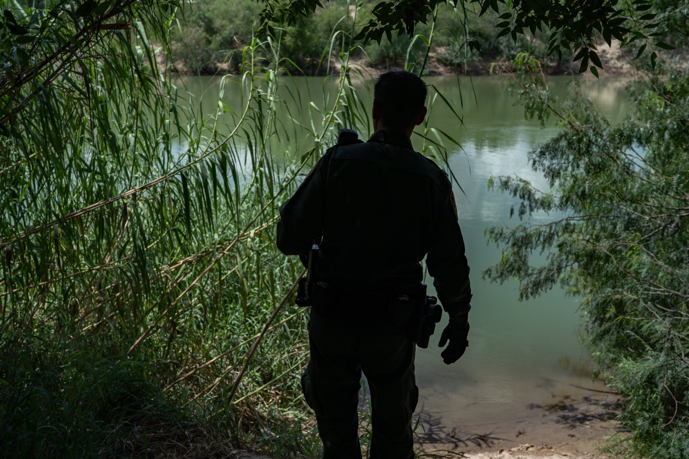 On U.S. soil a short boat ride from Mexico, Border Patrol agent Robert RodrÌguez, 38, checks a common landing area for people crossing the Rio Grande.