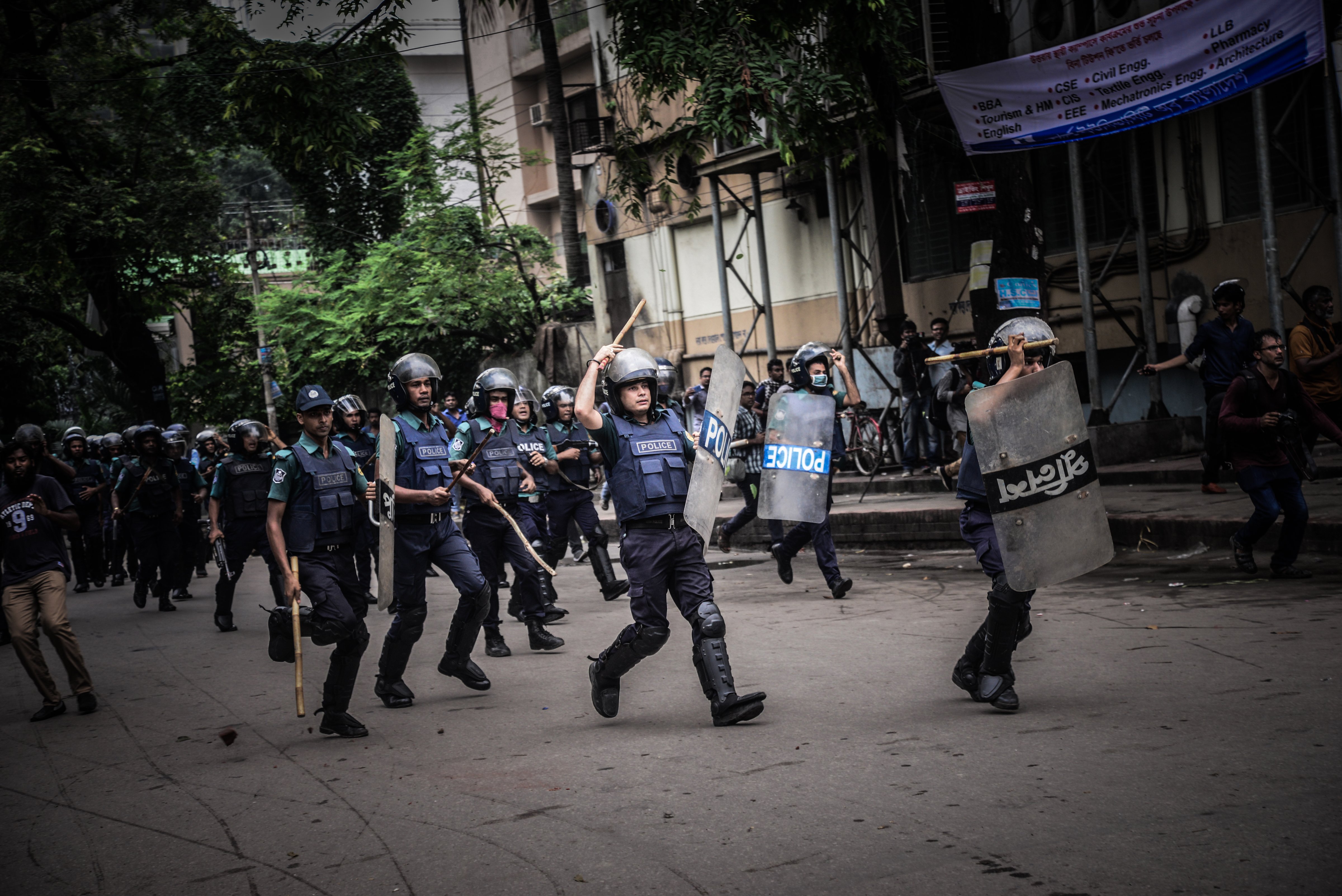 Bangladeshi police charge during a student protest in Dhaka on Aug. 5, 2018. (Mamunur Rashid—NurPhoto/Getty Images)