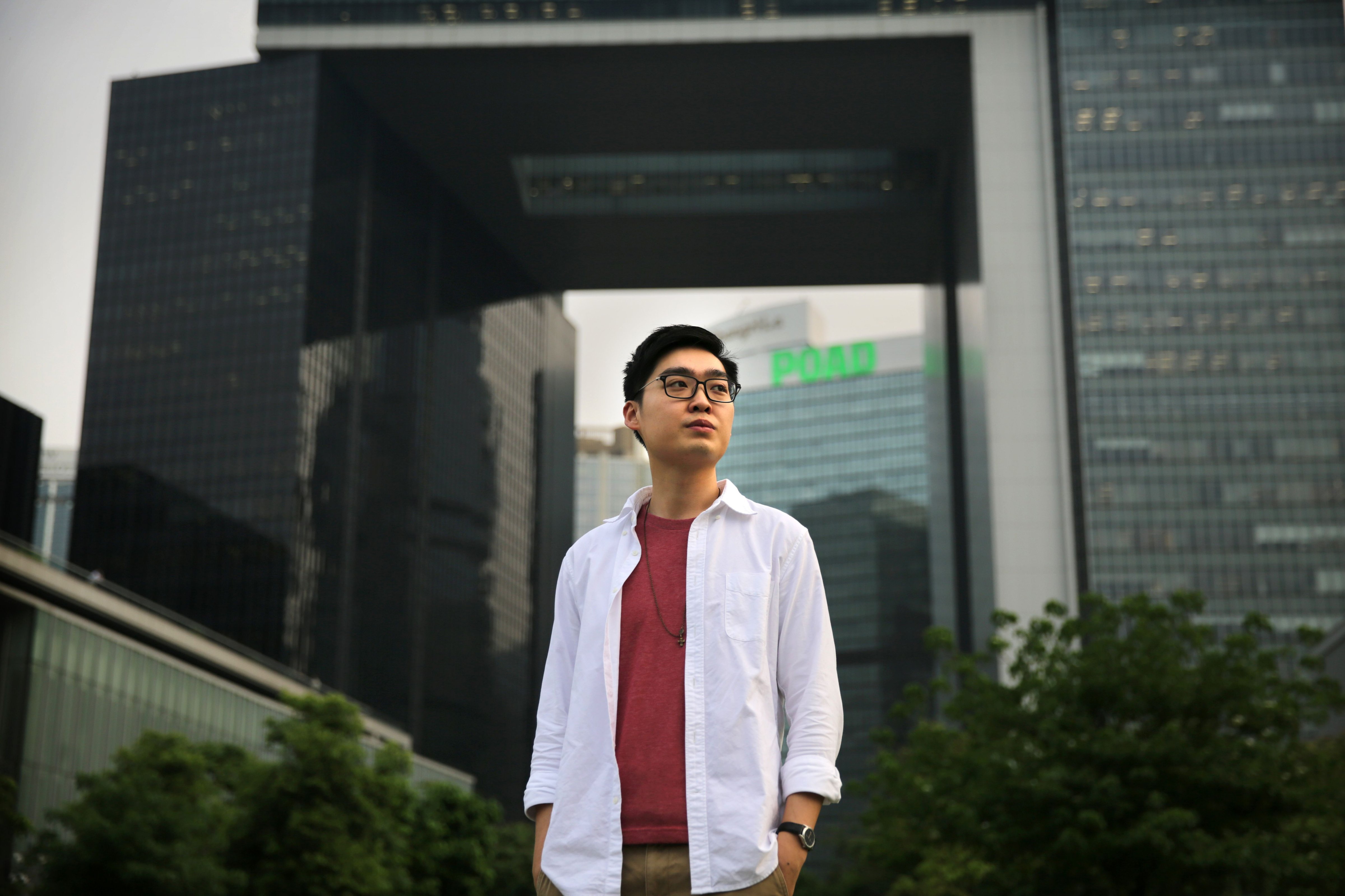 This picture taken on April 27, 2016 shows Hong Kong pro-independence leader Andy Chan, who set up the Hong Kong National Party (HKNP) in March, standing in Tamar Park in front of the Hong Kong Legislative Council buildings. (Isaac Lawrence—AFP/Getty Images)