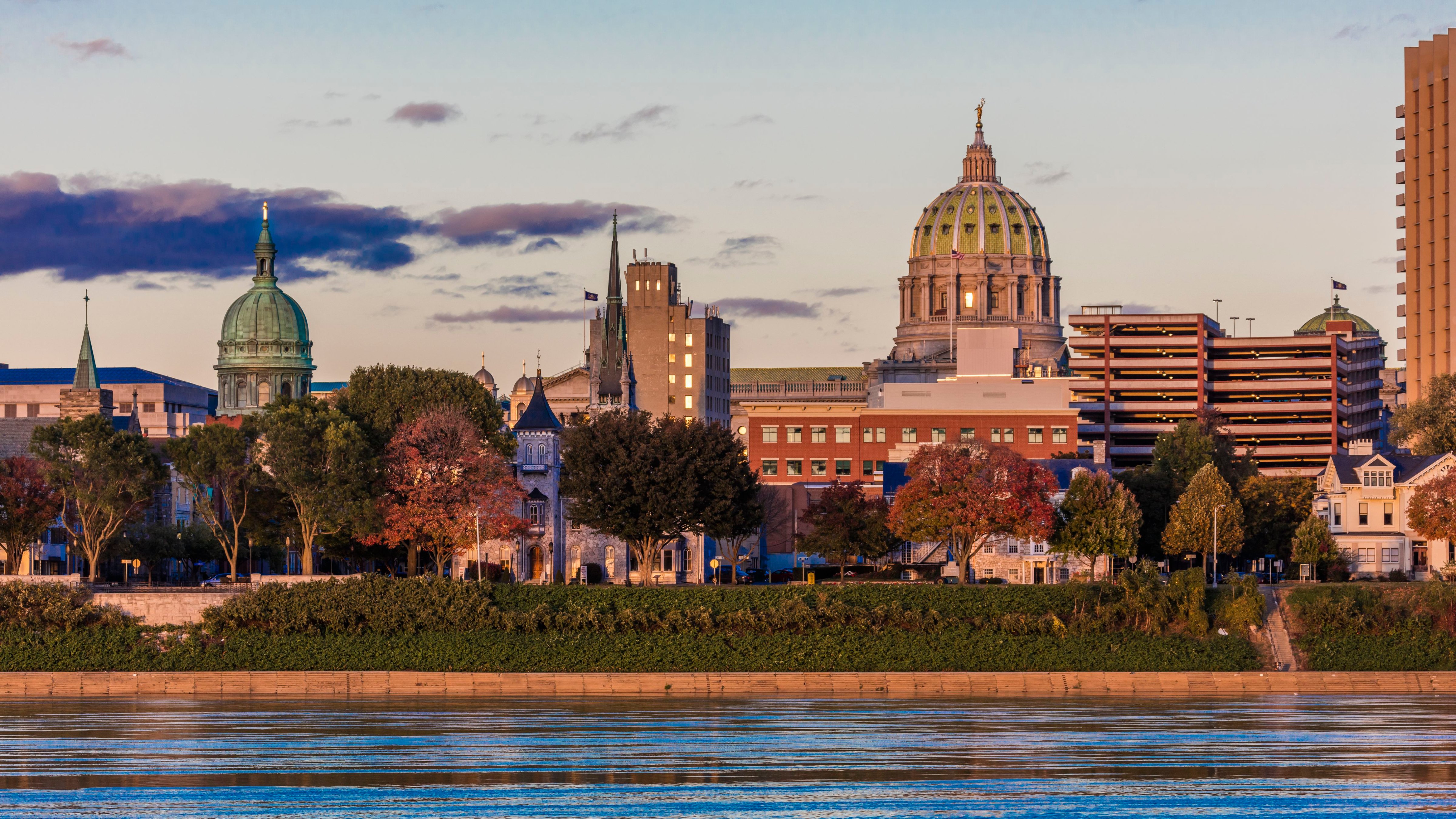Harrisburg, Pennsylvania, City skyline and State Capitol at dusk from Susquehanna River