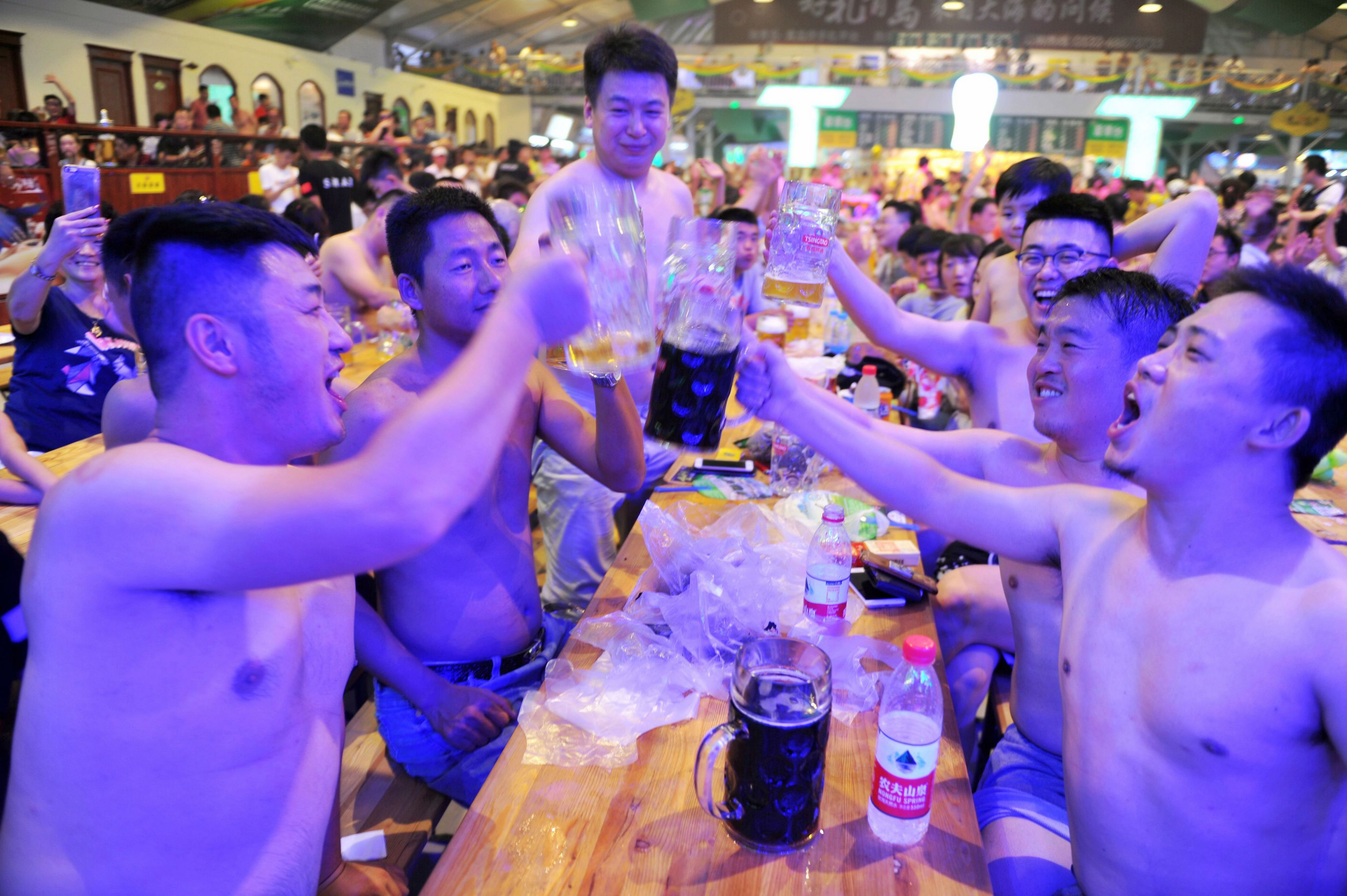 This photo taken on Aug. 7, 2017 shows people toasting at the annual Qingdao Beer Festival in China's eastern Shandong province. (AFP Contributor—AFP/Getty Images)
