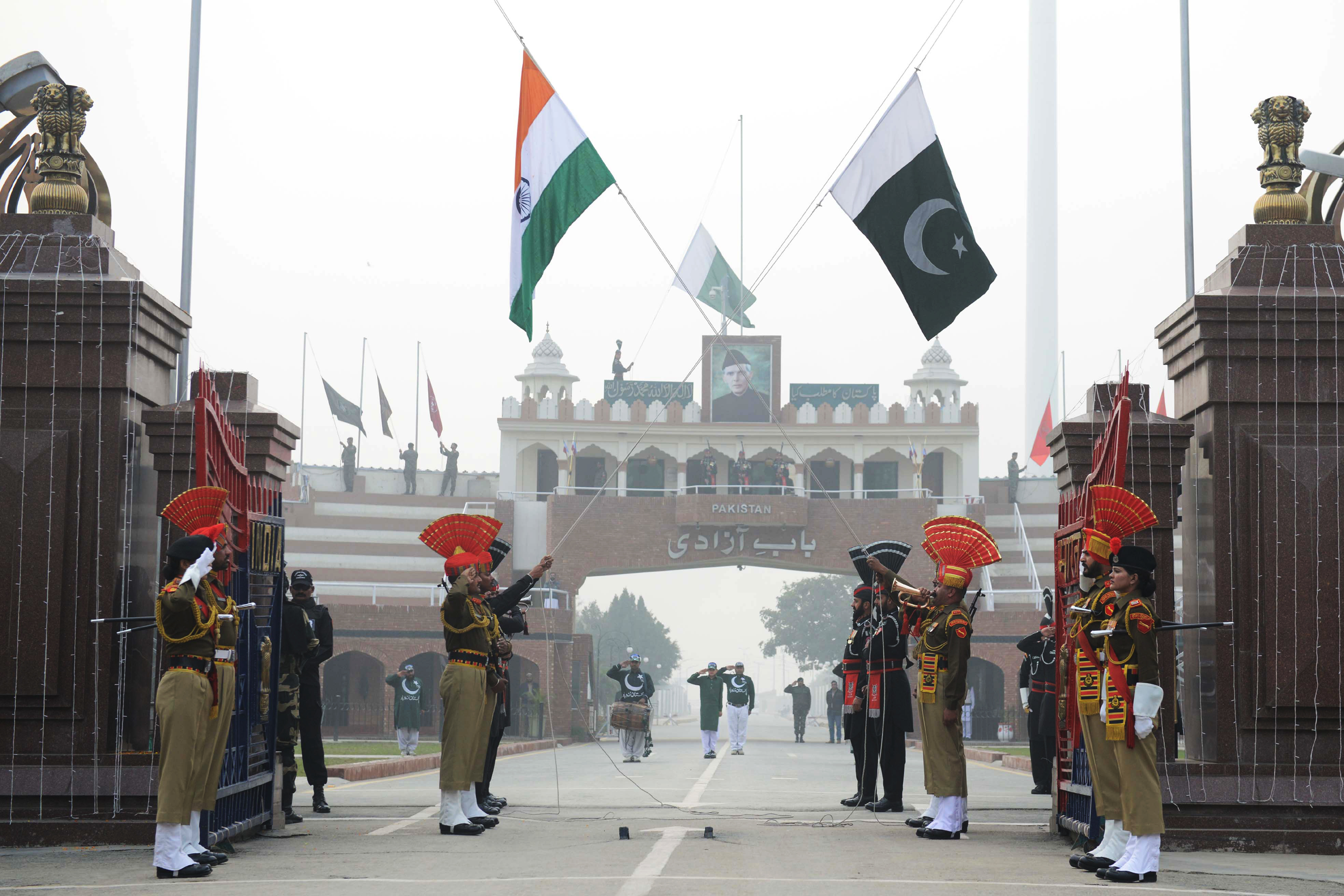 Pakistani Rangers (black uniforms) and Indian Border Security Force personnel (brown uniforms) at the Indian Pakistan Wagah Border post about 35km from Amritsar on Jan. 26, 2018. (Narinder Nanu&mdash;AFP/Getty Images)
