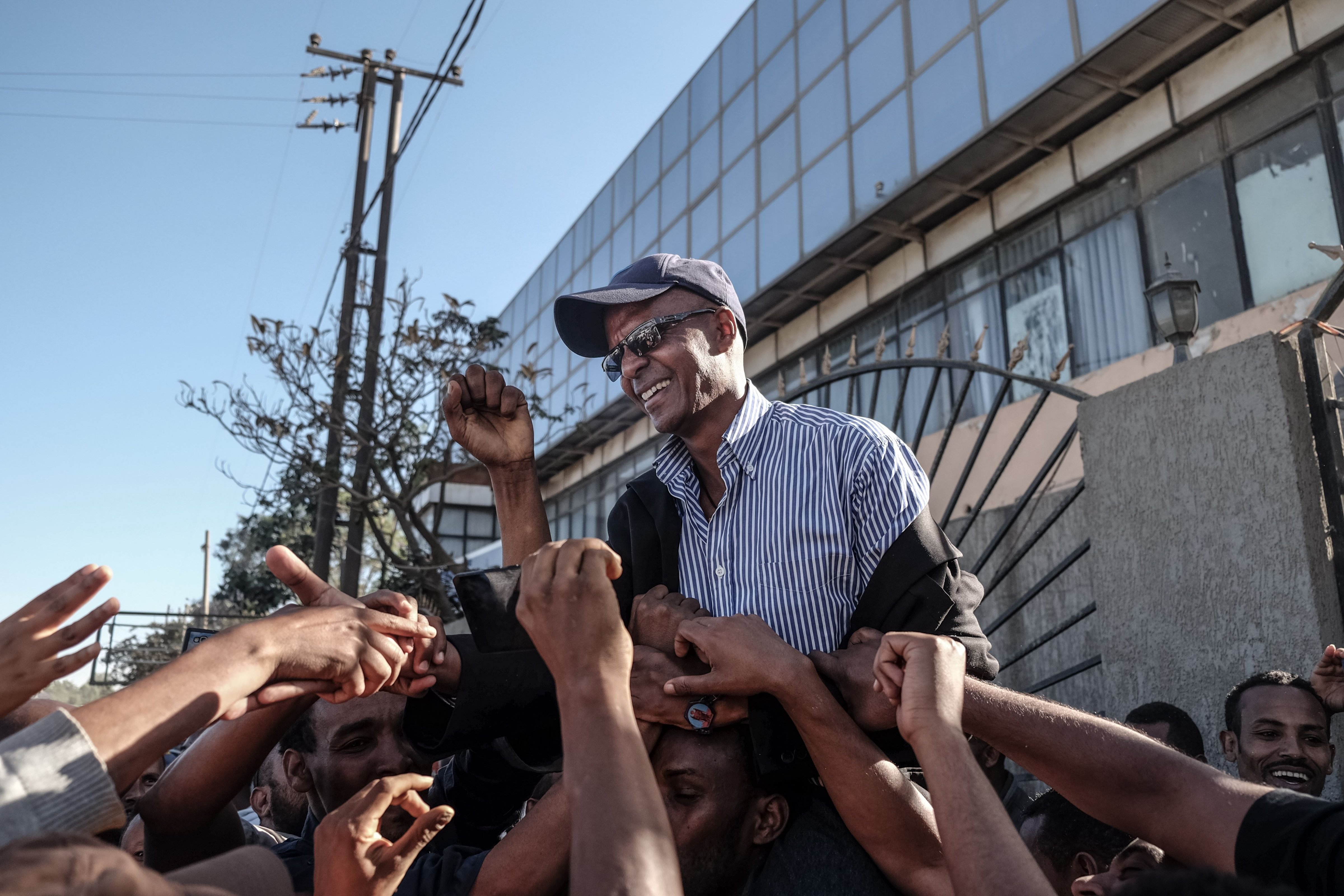Ethiopian journalist Eskinder Nega, who was given an 18-year prison sentence in 2012 on accusations of links to the banned Ginbot 7 group, reacts with people after being released from Kaliti Prison in Addis Ababa on February 14, 2018. (Yonas Tadesse –AFP/Getty Images)