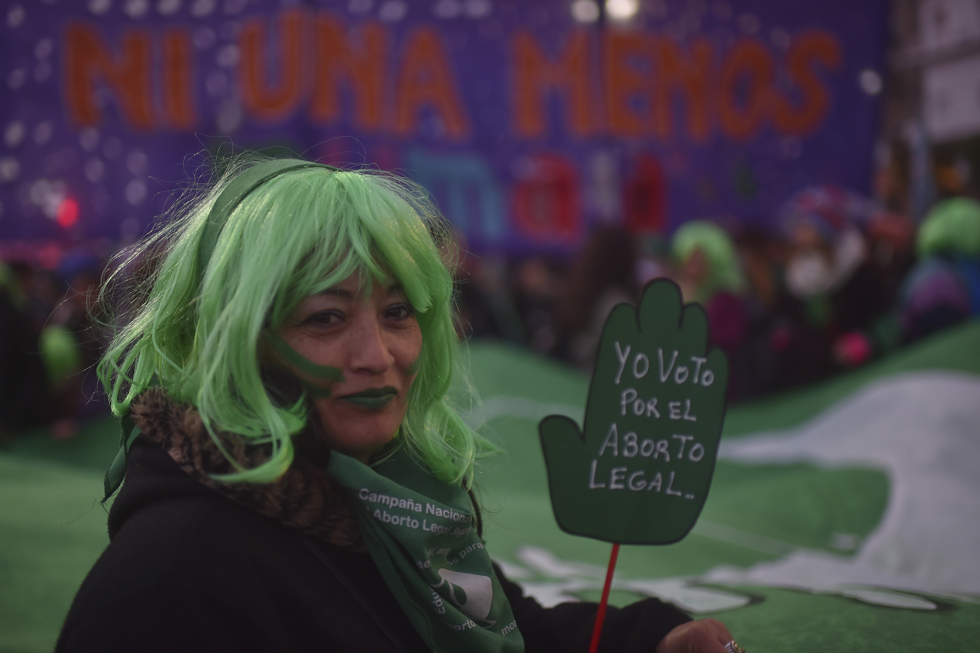A woman shows a sign that reads 'I vote in favour of legal abortion' during a protest as part of the 'Not One Less' (Ni Una Menos) movement demanding legal abortion on June 04, 2018 in Buenos Aires, Argentina. (Patrick Haar – Getty Images)