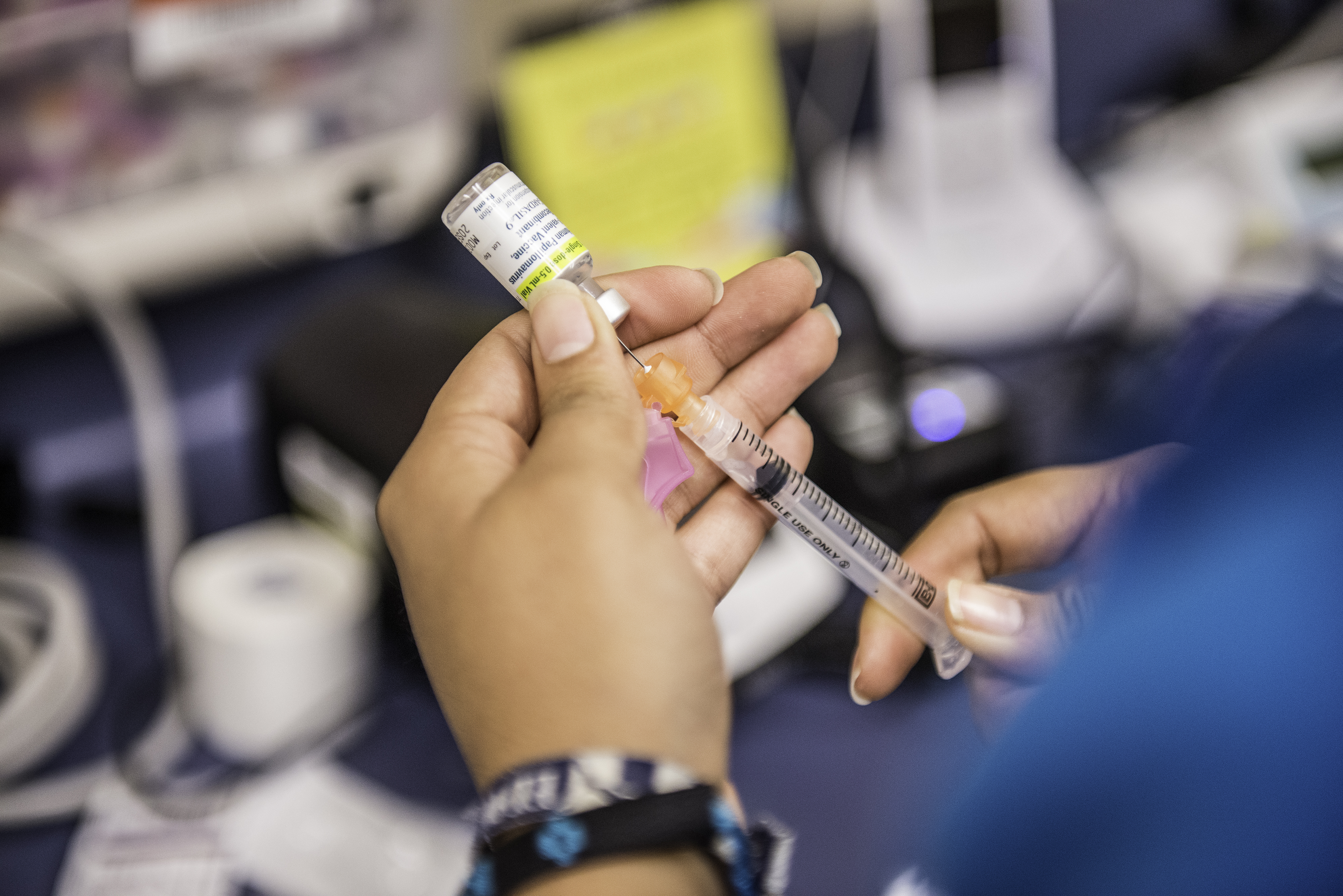 A medical assistant fills a needle with the drug Gardasil, used for HPV vaccinations, at Amistad Community Health Center in Corpus Christi, Texas on Friday May 27, 2016. (The Washington Post&mdash;The Washington Post/Getty Images)