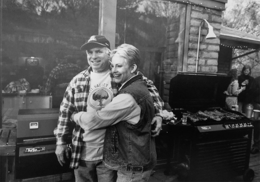 A previously unpublished image of Sen. John McCain with his wife Cindy enjoying a barbecue at his ranch outside Sedona, Arizona. "This is back in 2000 when the McCains welcomed me into their world. After bowing out of the race for the Republican nomination for president. Senator McCain invited then Gov. George Bush and his wife Laura to his Ranch. Putting aside the brutal... campaign that the Bush team ran against him." (Christopher Morris—VII for TIME)