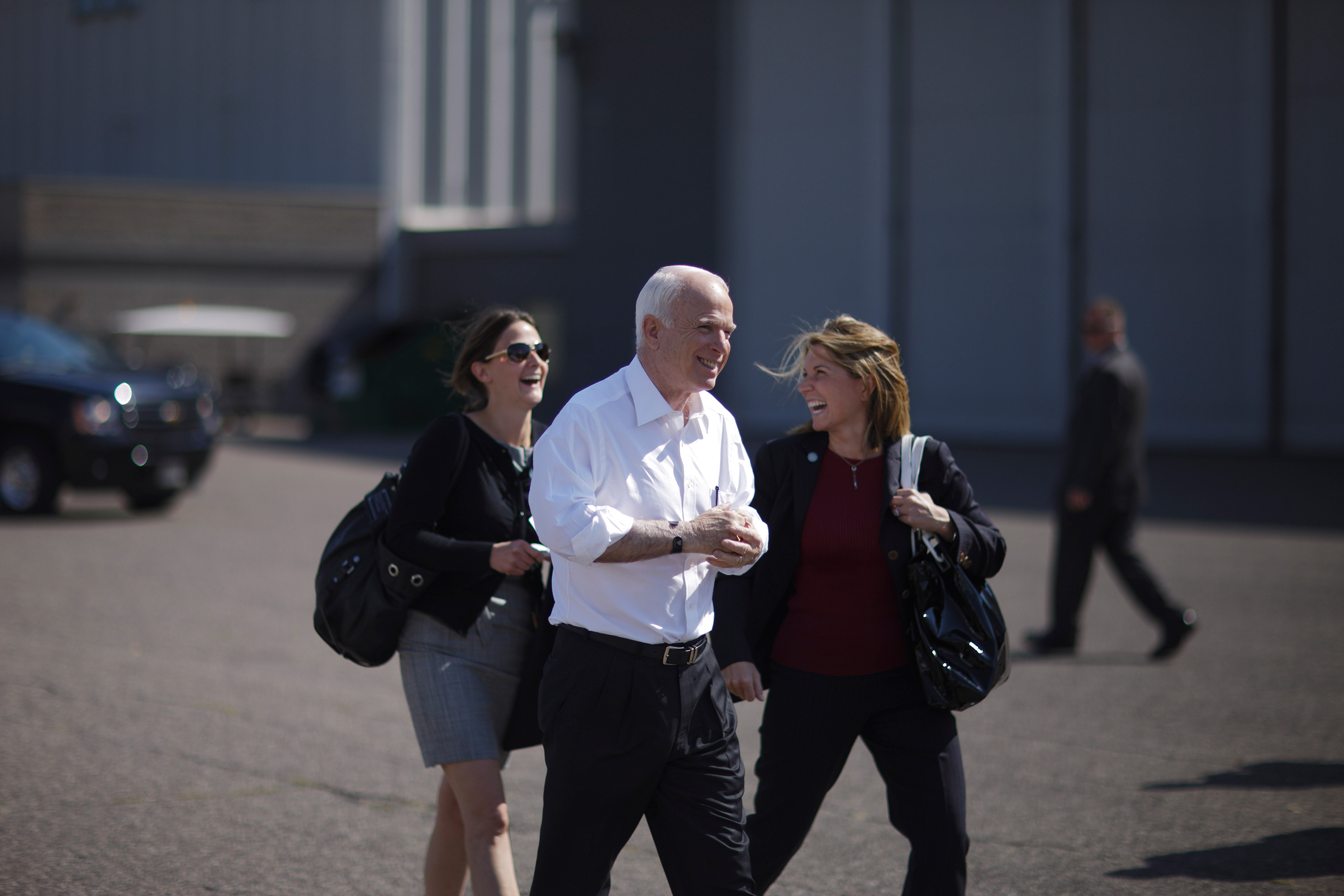 John McCain with staffers at the Key Air Hangar at the Anoka County Blaine Airport in Blaine, Minnesota on September 19, 2008. (Christopher Morris—VII for TIME Sen.)