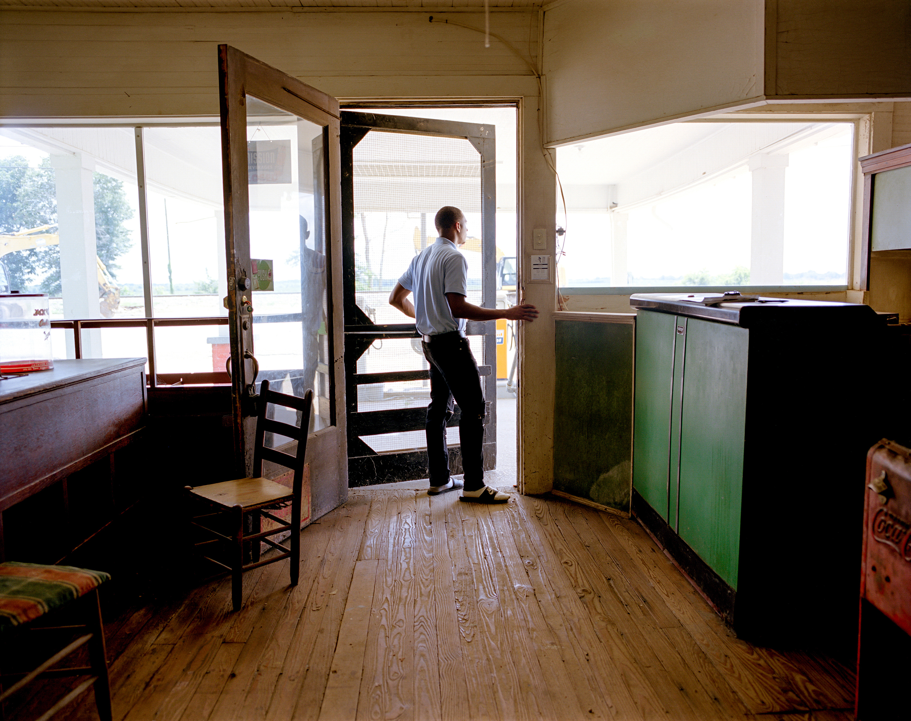 Rodkevian Thomas, an intern with the Emmett Till Interpretive Center, visits the restored service station adjacent to the dilapidated Bryant's Grocery in Money, Miss. On August 24, 1955, 14-year-old Emmett Till was visiting Bryant’s Grocery when he was accused of violating the racial customs of the time by whistling at a white woman. He was then kidnapped, beaten and, on Aug. 28, lynched. (Johnathon Kelso)