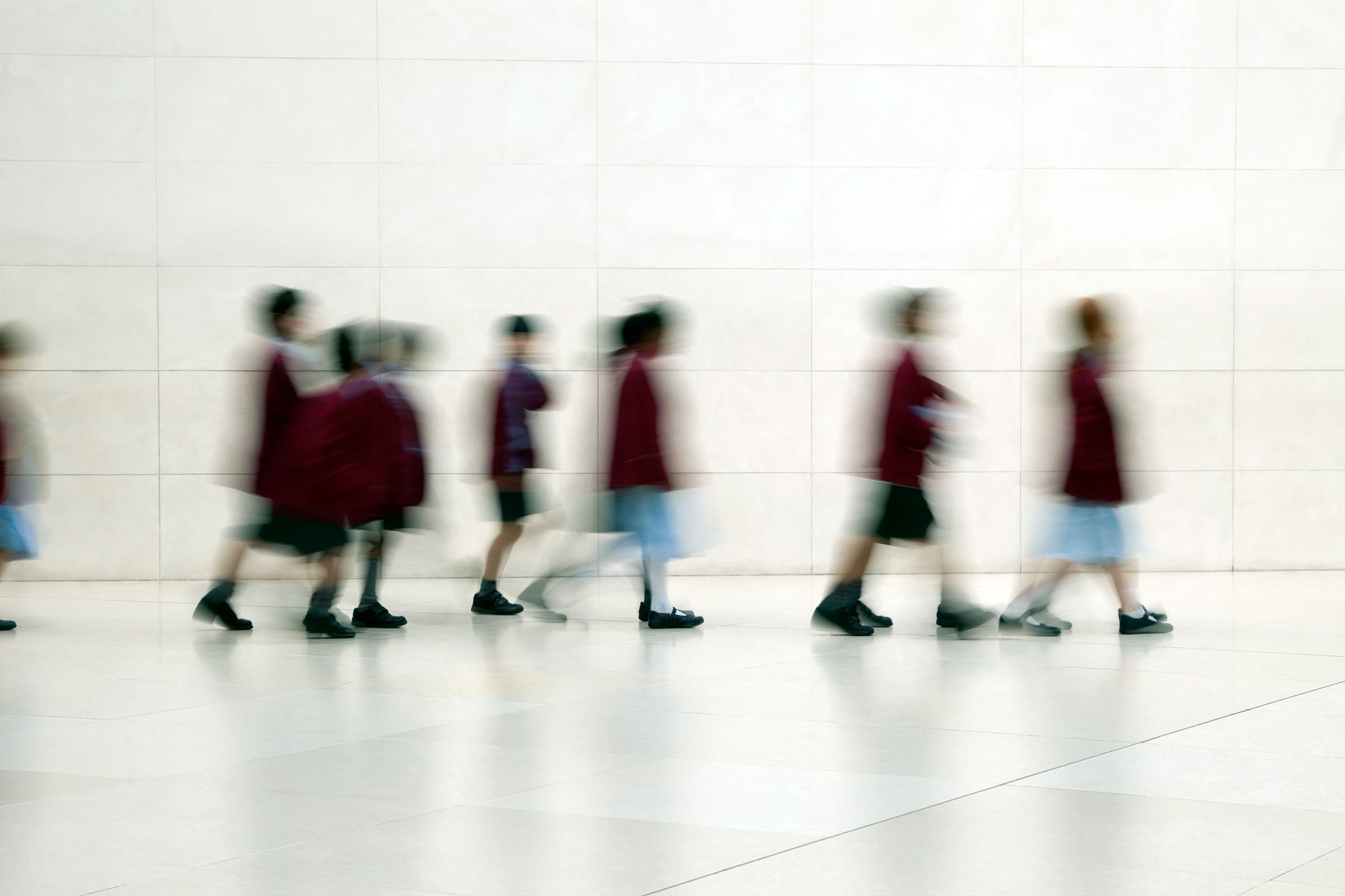 School Children Walking in Corridor