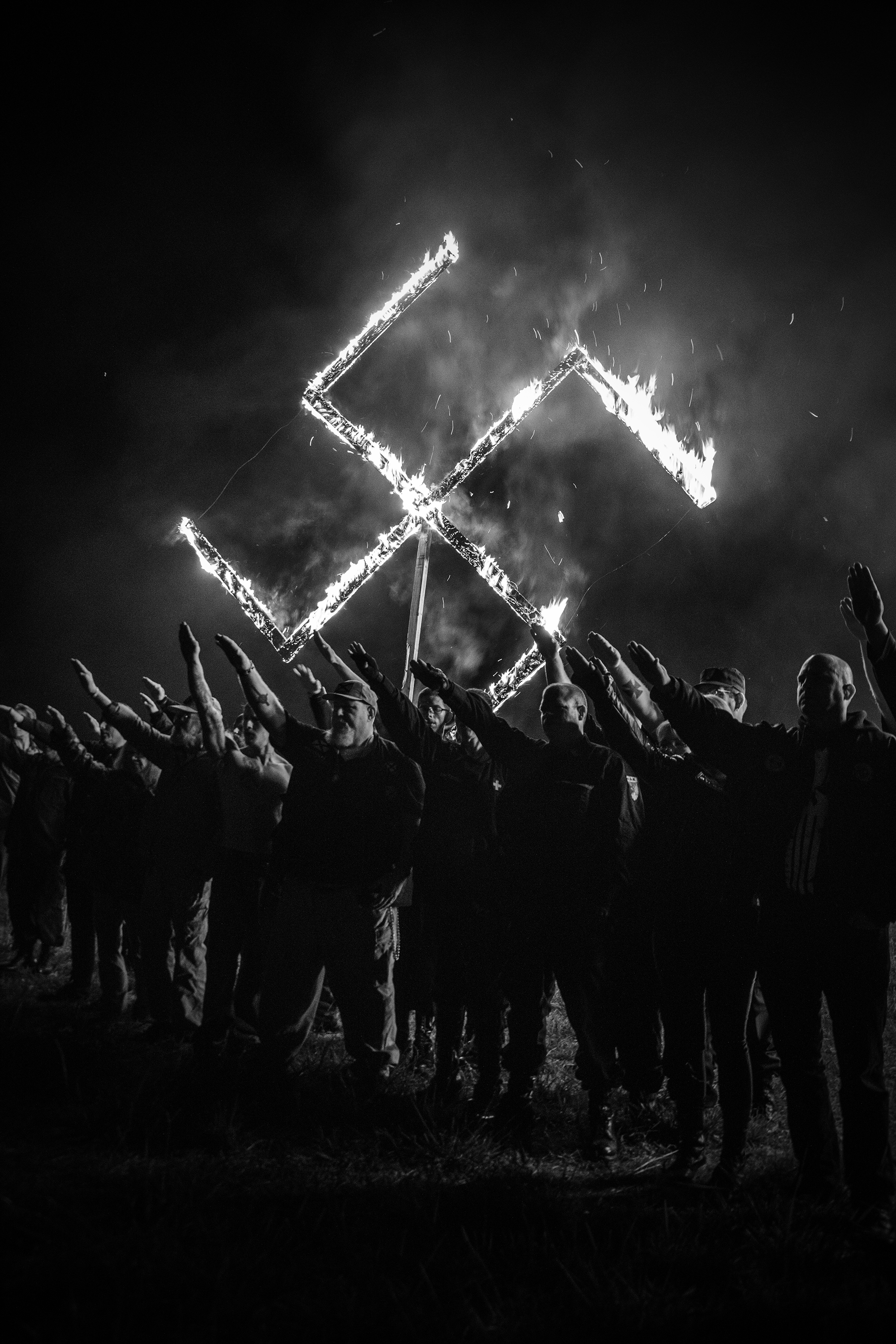 The National Socialist Movement holds a lighting ceremony following a rally that was held in Newnan, Ga., on April 21, 2018. (Mark Peterson—Redux)