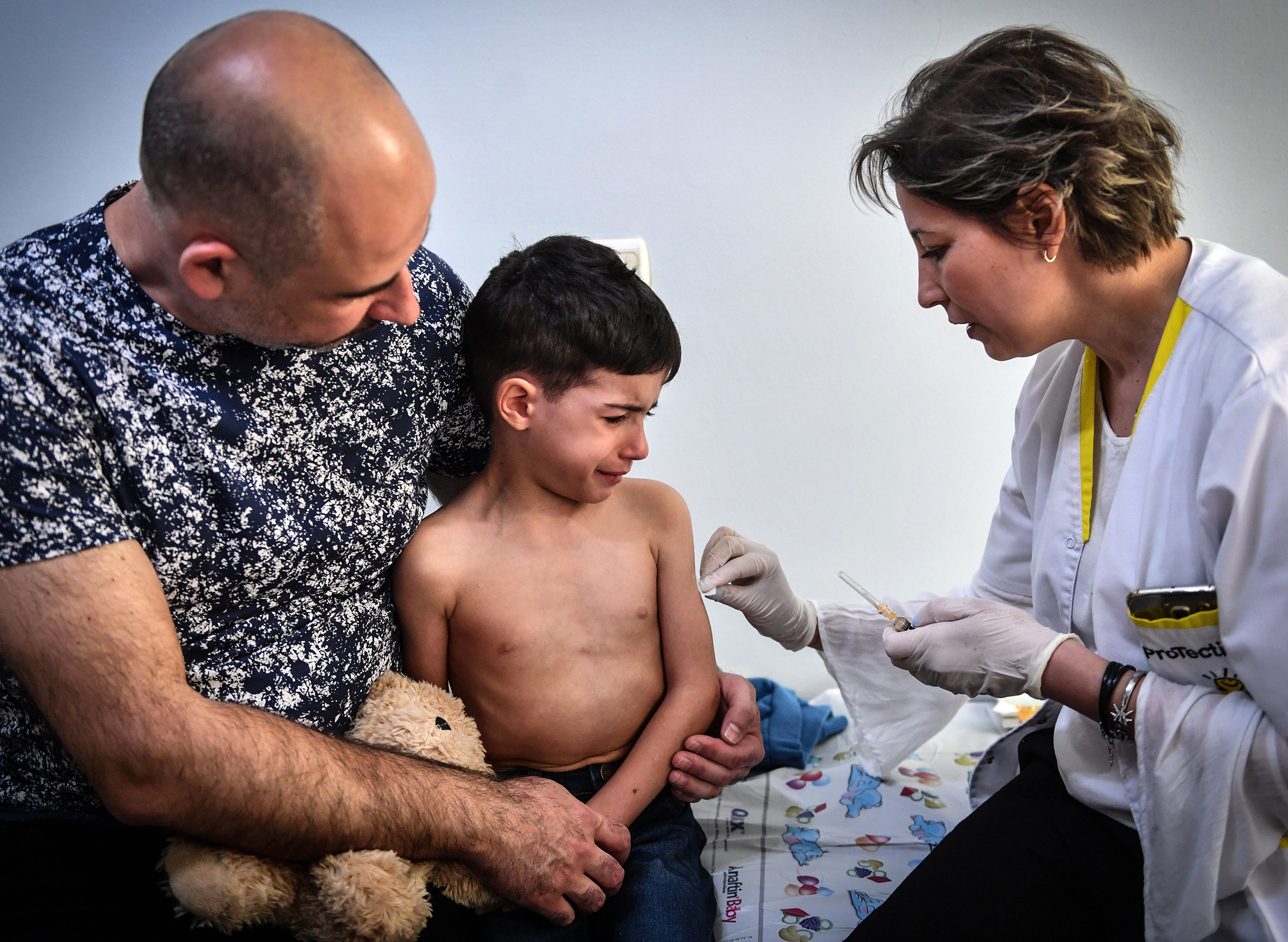 A child receives a vaccination against measles by a family physician on April 16, 2018 in the Romanian capital, Bucharest in Europe. (Daniel Mihailescu—AFP/Getty Images)